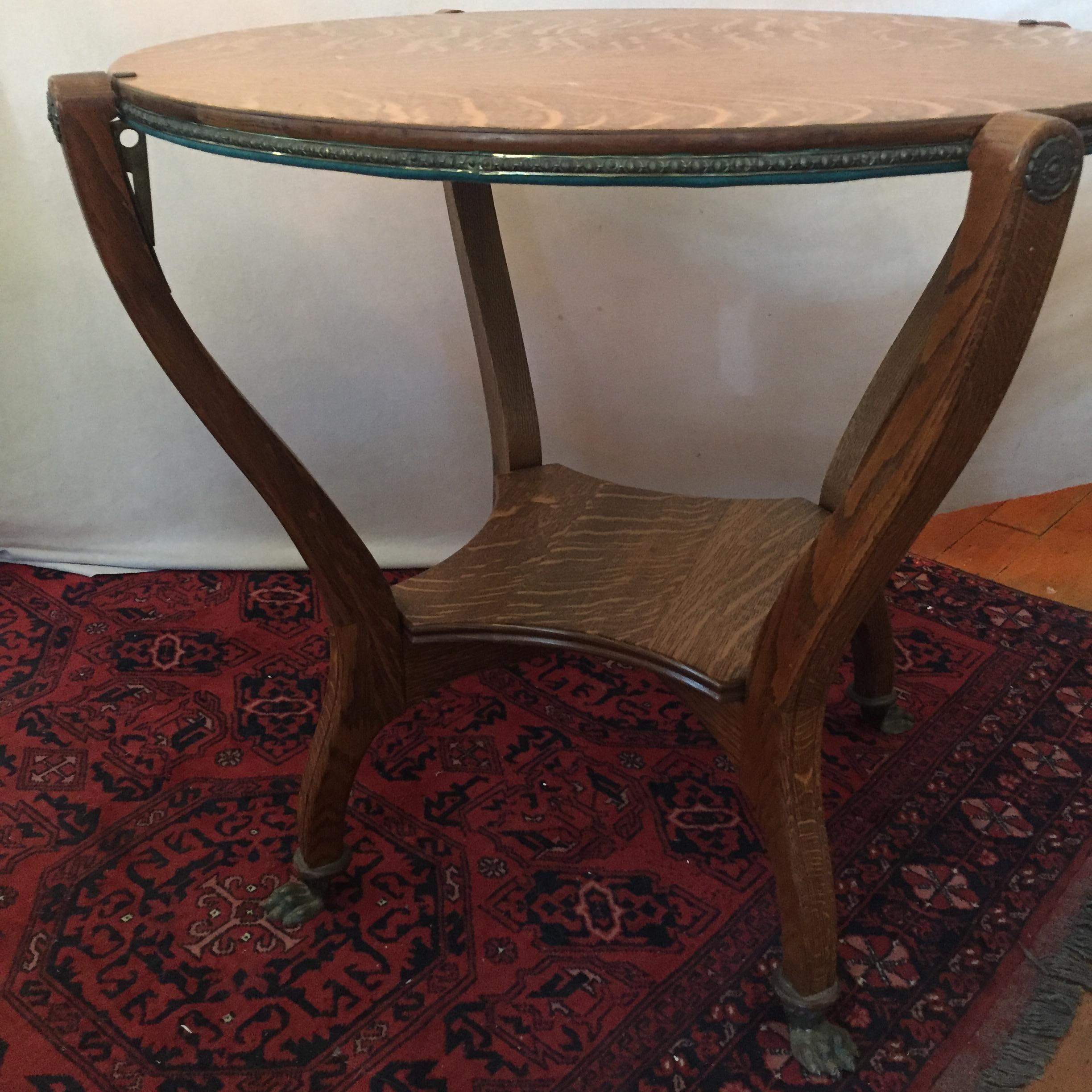 Hard to find, and especially in this condition, quarter sawn oak game table. Metal claw feet and an easy to operate mechanism to rotate the table add to the list of its quality characteristics. Curvy legs, beaded border, striking oak color and grain