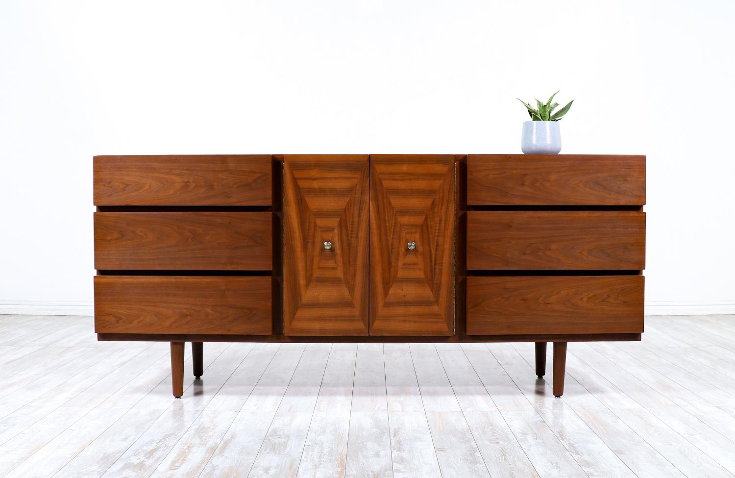 American of Martinsville 9-drawers walnut dresser.

________________________________________

Transforming a piece of Mid-Century Modern furniture is like bringing history back to life, and we take this journey with passion and precision. With over