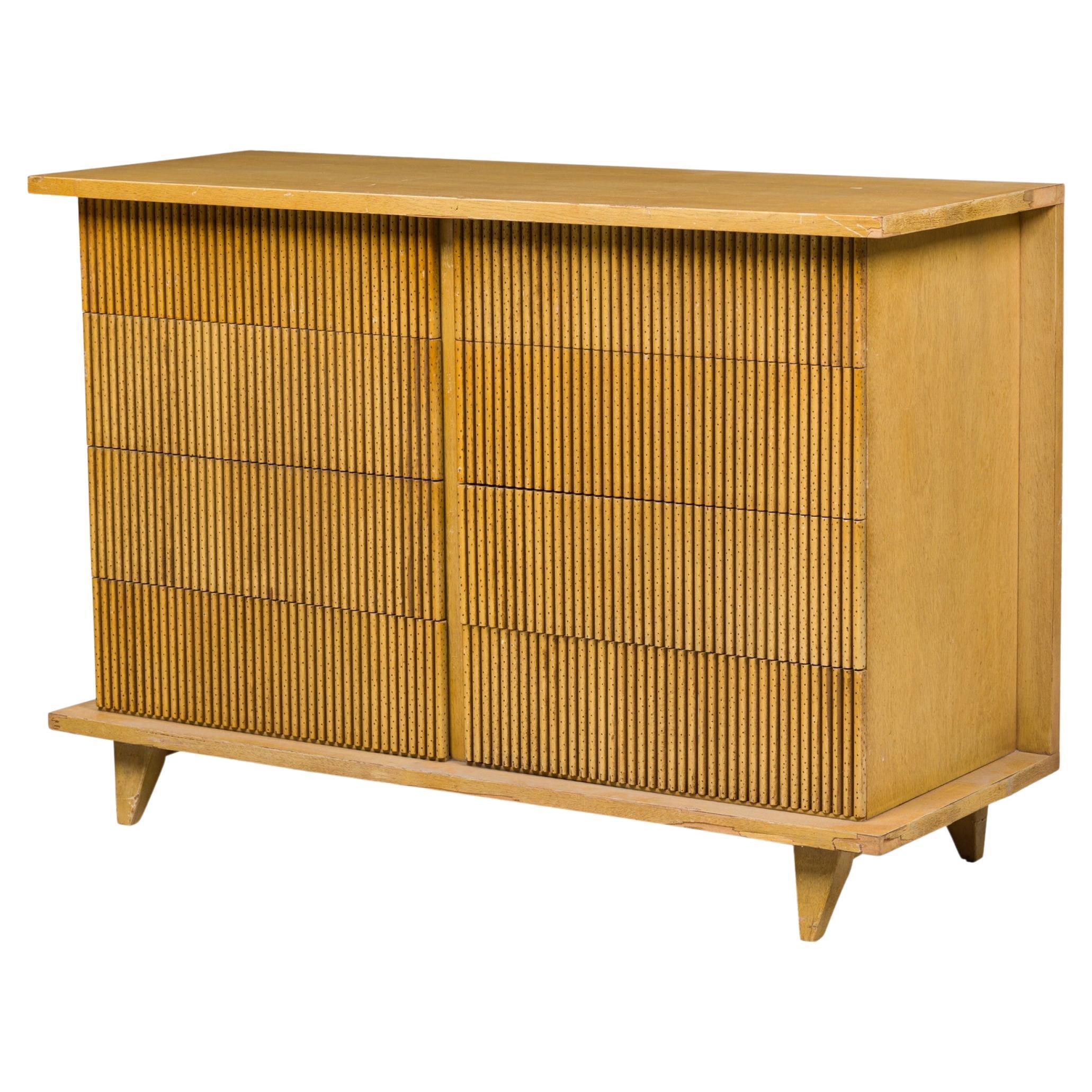 American midcentury (1960s) bleached mahogany chest / dresser with 8 drawers in two parallel columns with reeded faux-bamboo fronts, resting on four square tapered legs. (American of Martinsville).