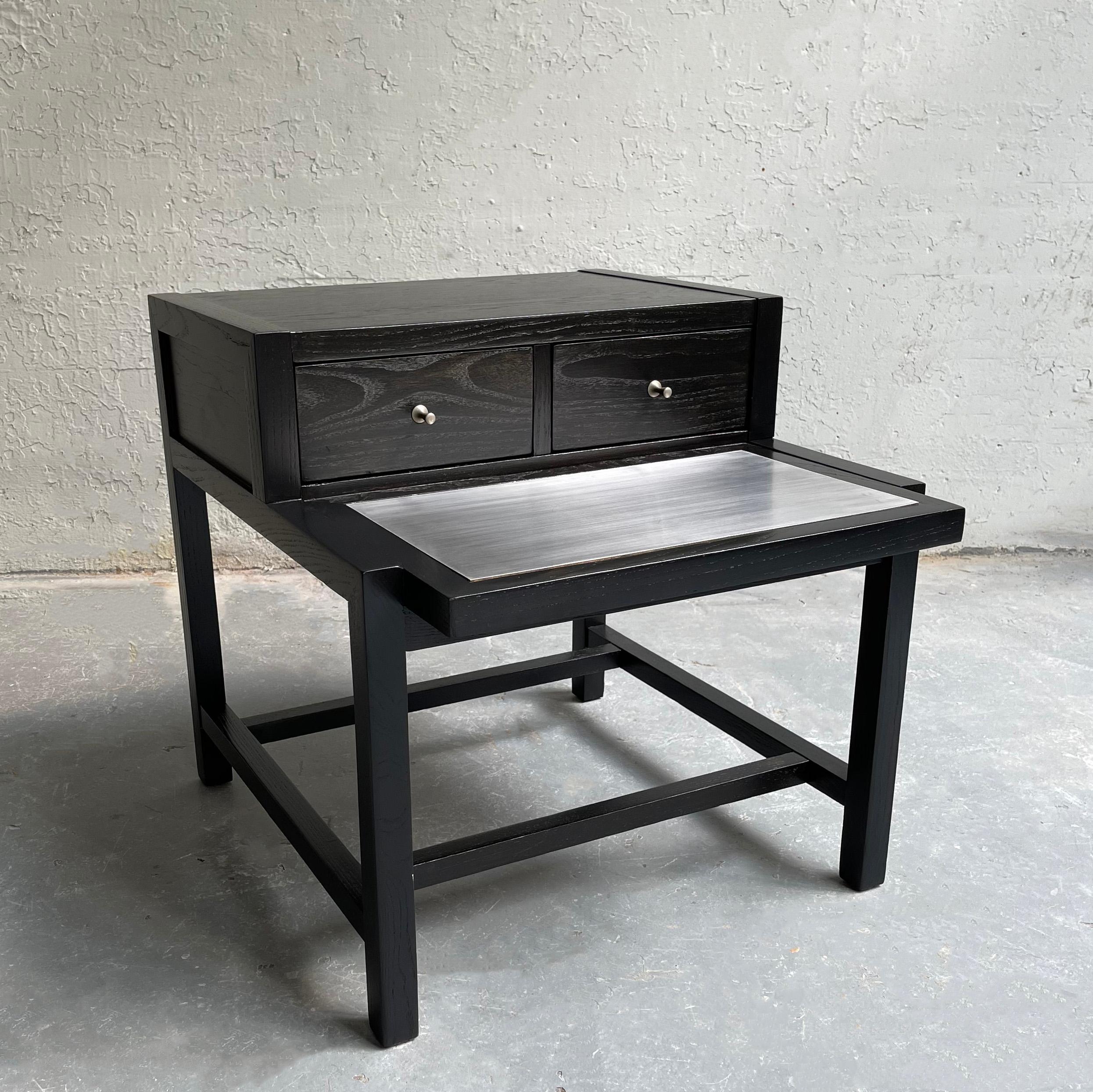 Mid-Century Modern, ebonized ash, stepped side table by American of Martinsville features a lower tier with steel inlay at 16.5 inches height.