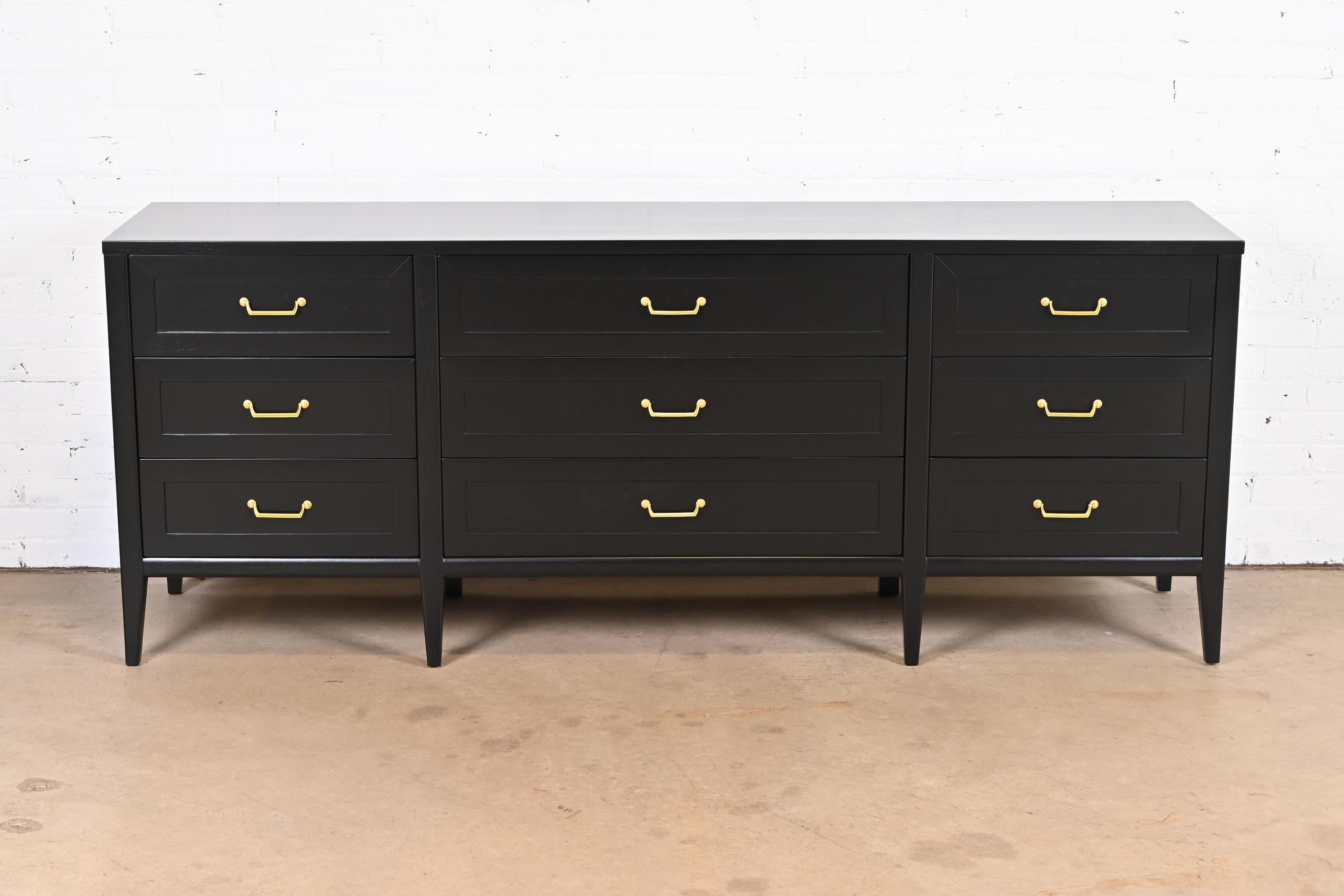A gorgeous mid-century French Regency style triple dresser or credenza

By American of Martinsville

USA, 1960s

Black lacquered walnut, with original brass hardware.

Measures: 80.25