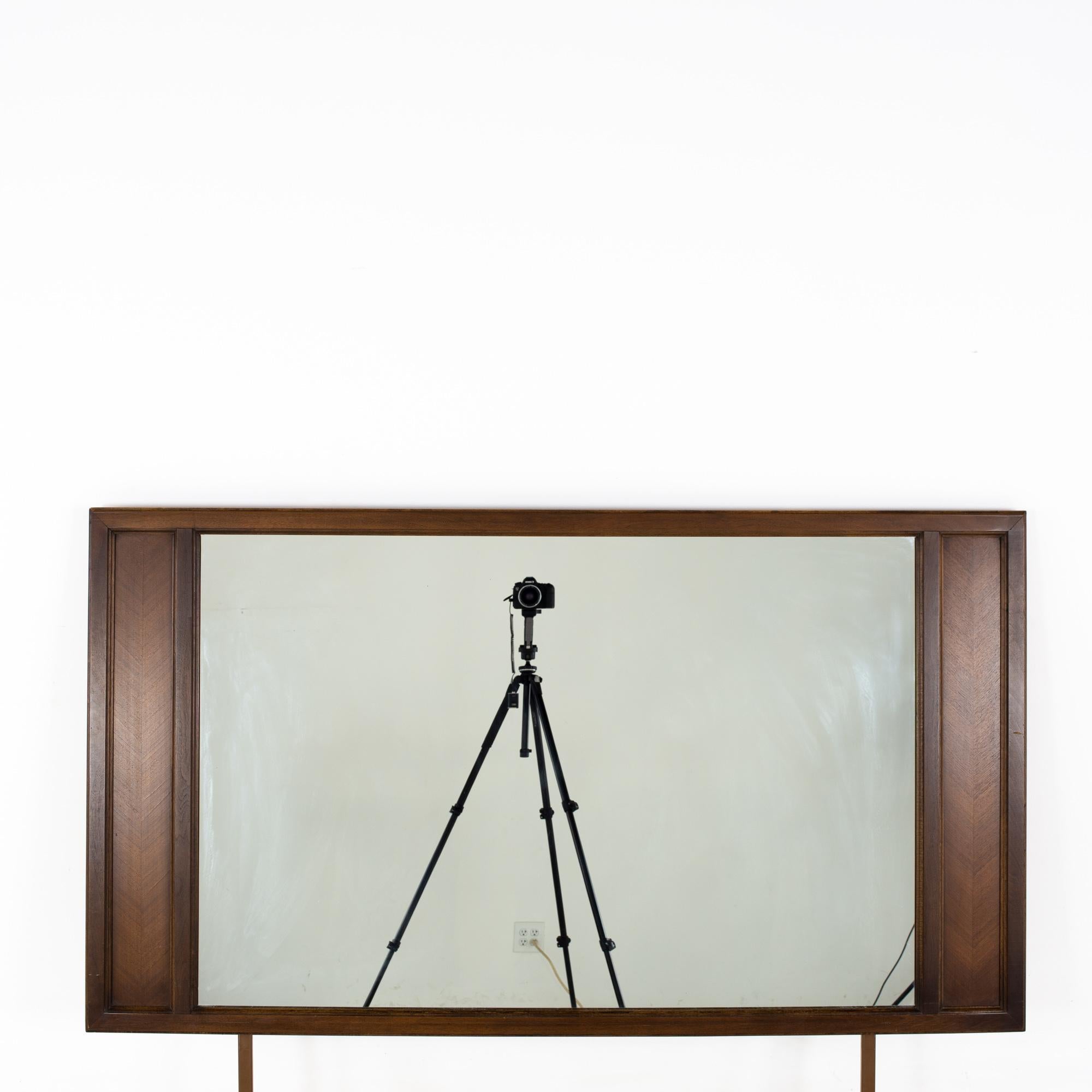 American of Martinsville Mid Century Harlequin Walnut Mirror
Mirror measures: 61 wide x 1 deep x 48 inches high

All pieces of furniture can be had in what we call restored vintage condition. That means the piece is restored upon purchase so it’s