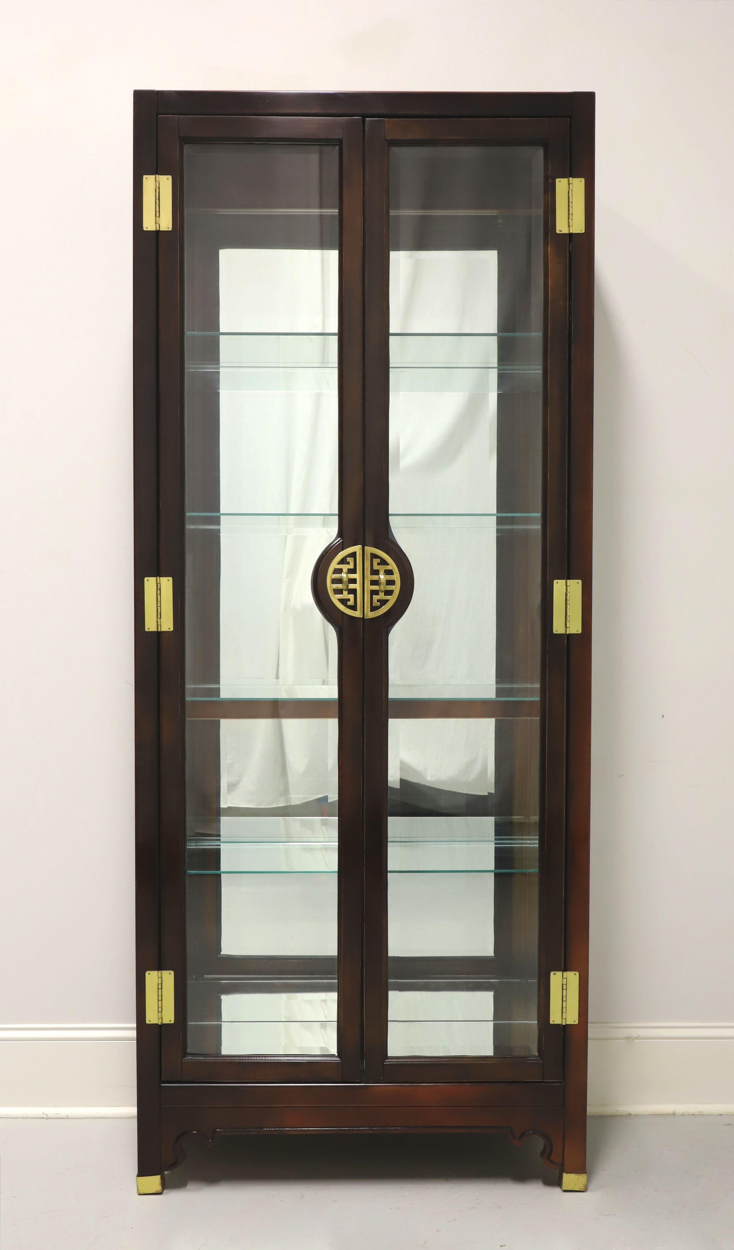 An Asian Chinoiserie style curio cabinet by American of Martinsville. Solid highly polished mahogany, decorative Chinoiserie brass hardware, dual beveled glass front doors and glass side panels. Features lighted interior cabinet with mirrored back