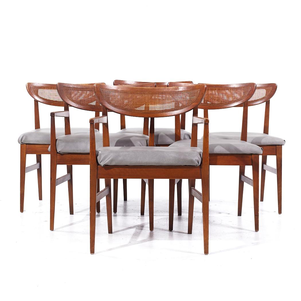 American of Martinsville Mid Century Walnut and Cane Back Dining Chairs - Set of 6

Each armless chair measures: 20.5 wide x 21 deep x 31.5 high, with a seat height of 19.5 inches
Each captains chair measures: 23 wide x 20.25 deep x 31.5 high, with