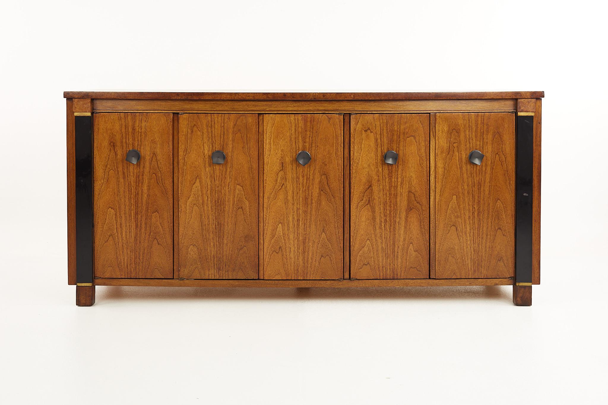 American of Martinsville mid century walnut and burlwood credenza

This credenza measures: 68 wide x 19 deep x 31 inches high

All pieces of furniture can be had in what we call restored vintage condition. That means the piece is restored upon