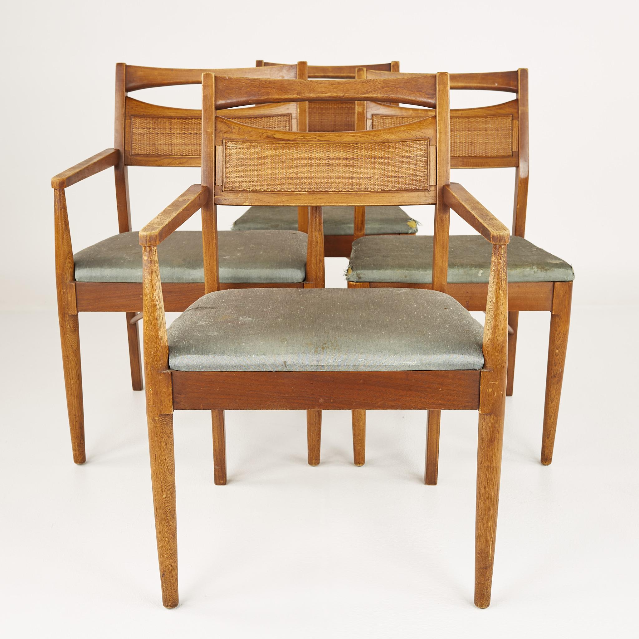 American of Martinsville mid century walnut and cane back dining chairs - set of 4

These chairs measure: 22.25 wide x 21.25 deep x 33.75 inches high, with a seat height of 17.75 and an arm height of 25.25 inches

?All pieces of furniture can be