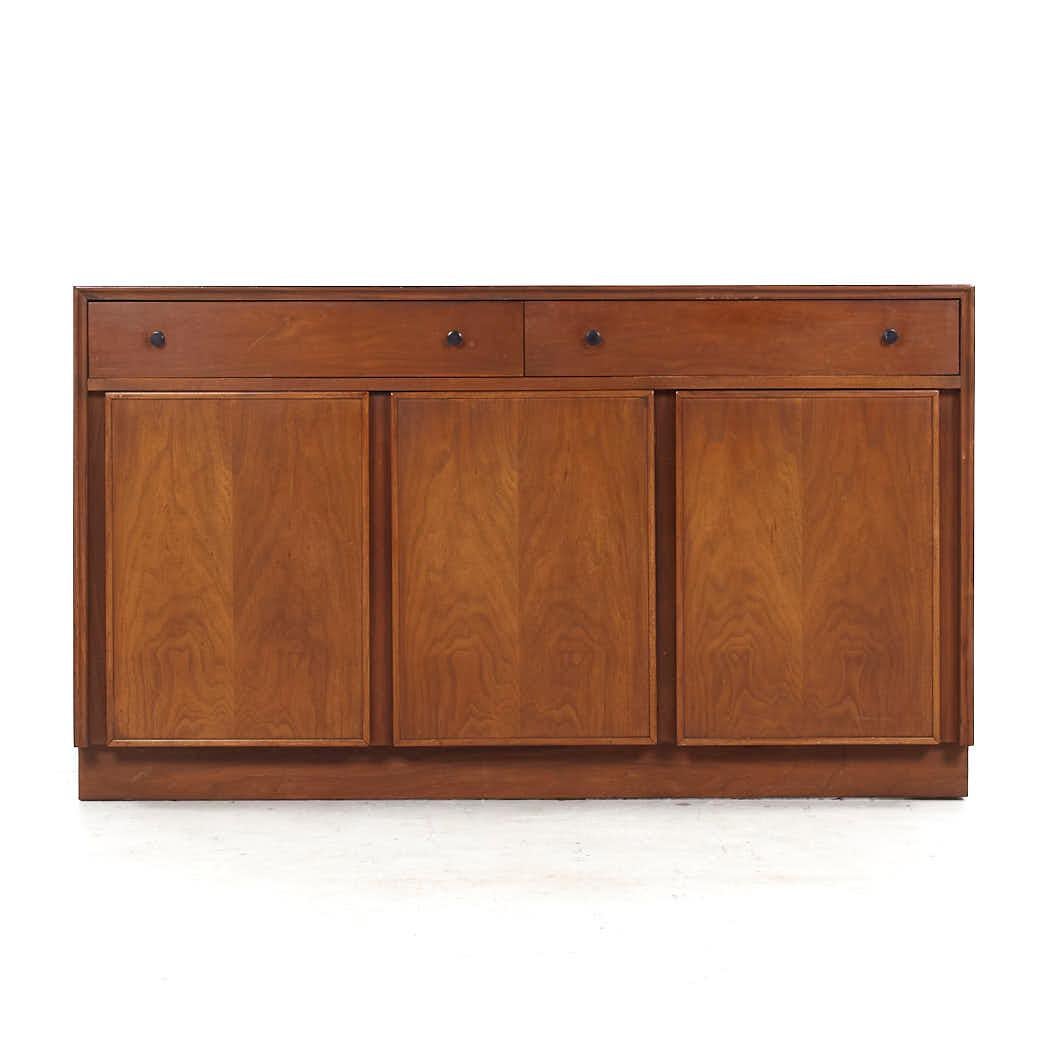 American of Martinsville Mid Century Walnut Credenza

This credenza measures: 52 wide x 18 deep x 30 inches high

All pieces of furniture can be had in what we call restored vintage condition. That means the piece is restored upon purchase so it’s