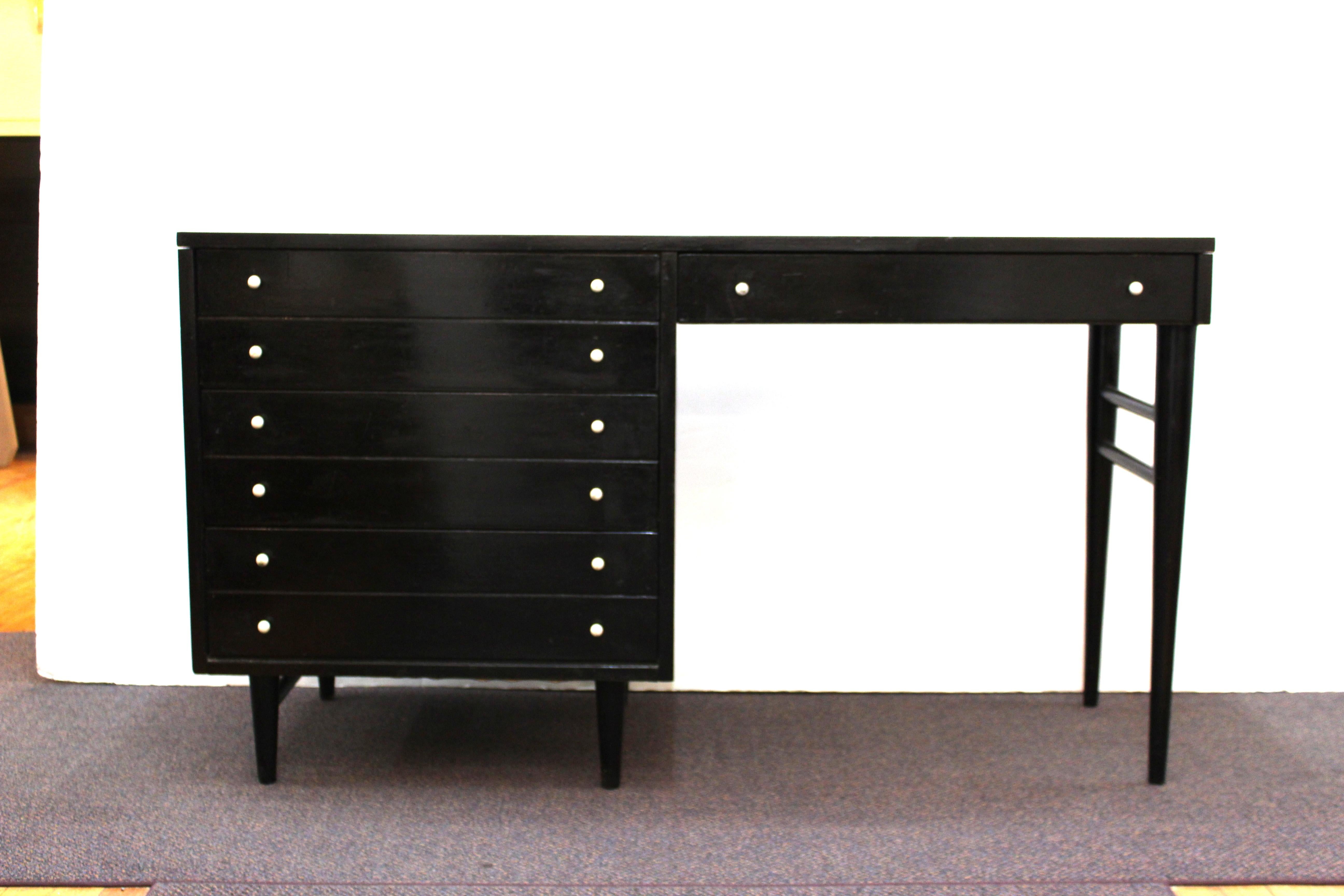 Mid-Century Modern black lacquered writing desk by American of Martinsville, with white Formica top. The piece was made in the United States during the 1960s and is in great vintage condition with age-appropriate wear and previous old restoration