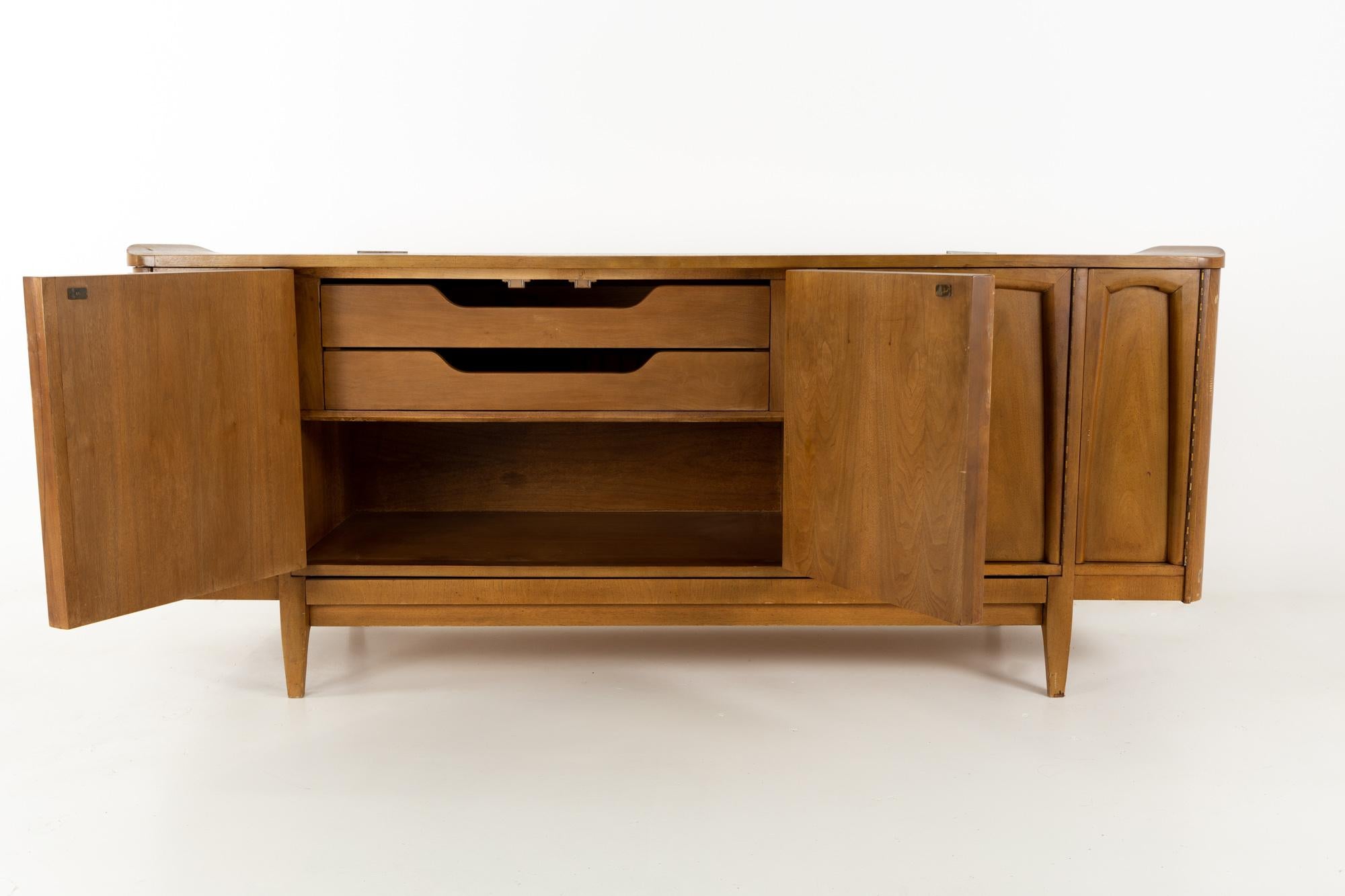 American of Martinsville Mid Century walnut sideboard buffet credenza
This piece is 74 wide x 19.25 deep x 30.75 inches high

This price includes getting this piece in what we call restored vintage condition. That means the piece is permanently