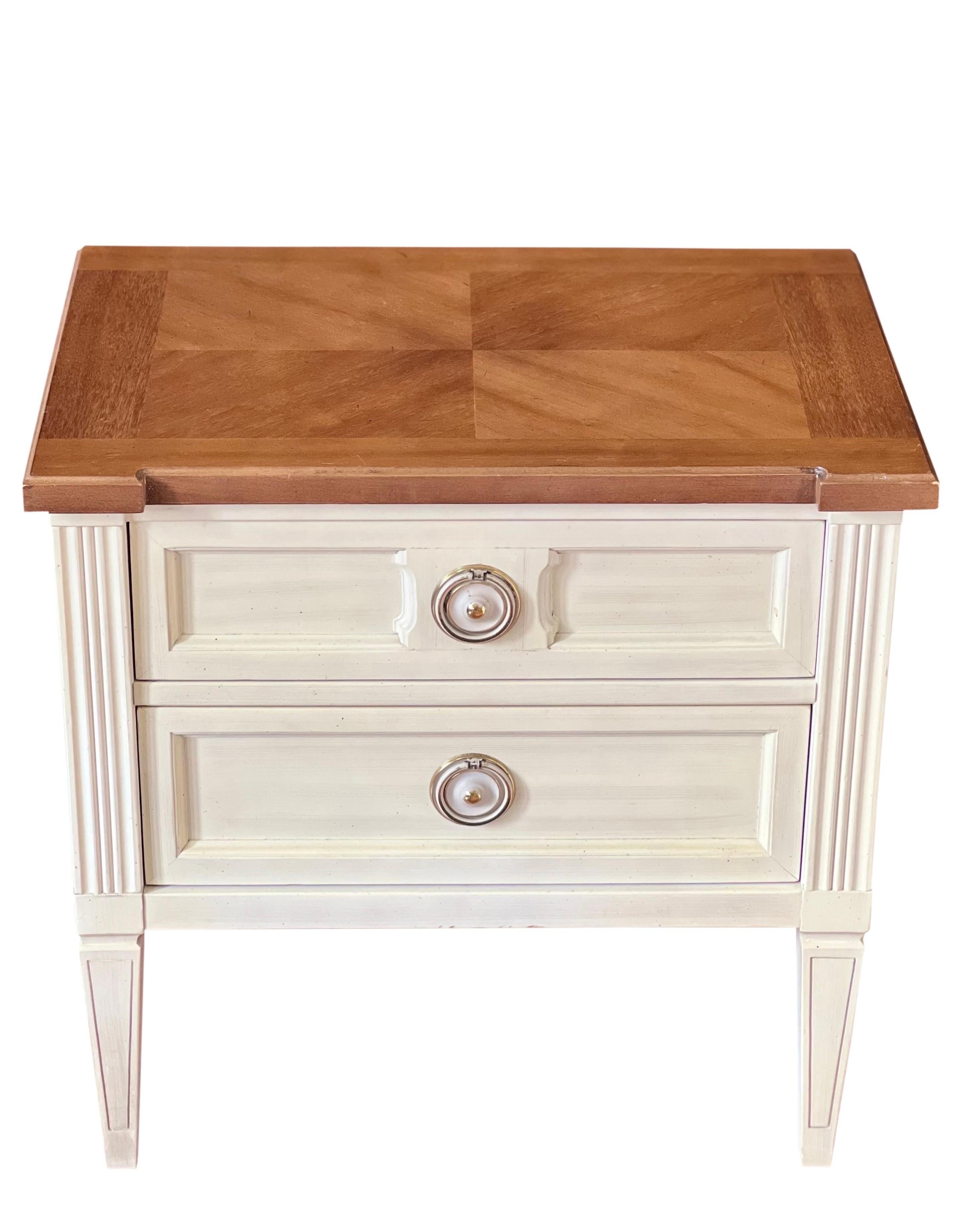 white nightstand with wood top