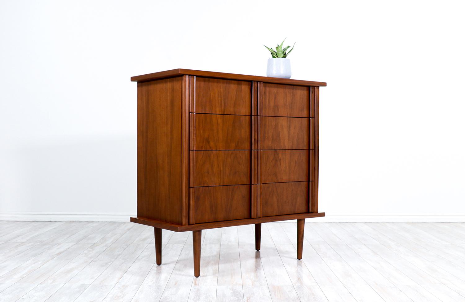 American of Martinsville sculpted walnut highboy.

________________________________________

Transforming a piece of Mid-Century Modern furniture is like bringing history back to life, and we take this journey with passion and precision. With over