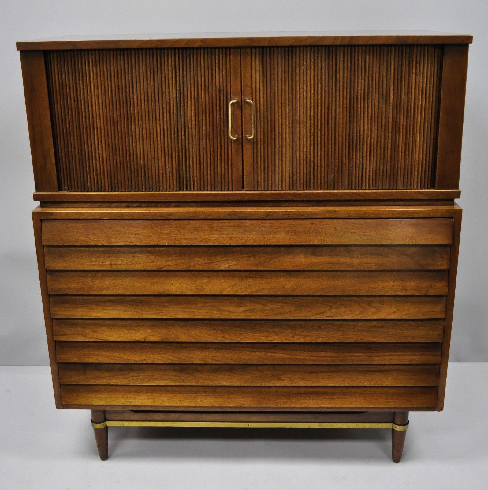 Mid-Century Modern walnut louvered drawers dresser by American of Martinsville. Item features two tambour sliding doors, brass stretcher accents, three louvered drawers, beautiful wood grain, serial number #4004-85, five dovetailed drawers, and