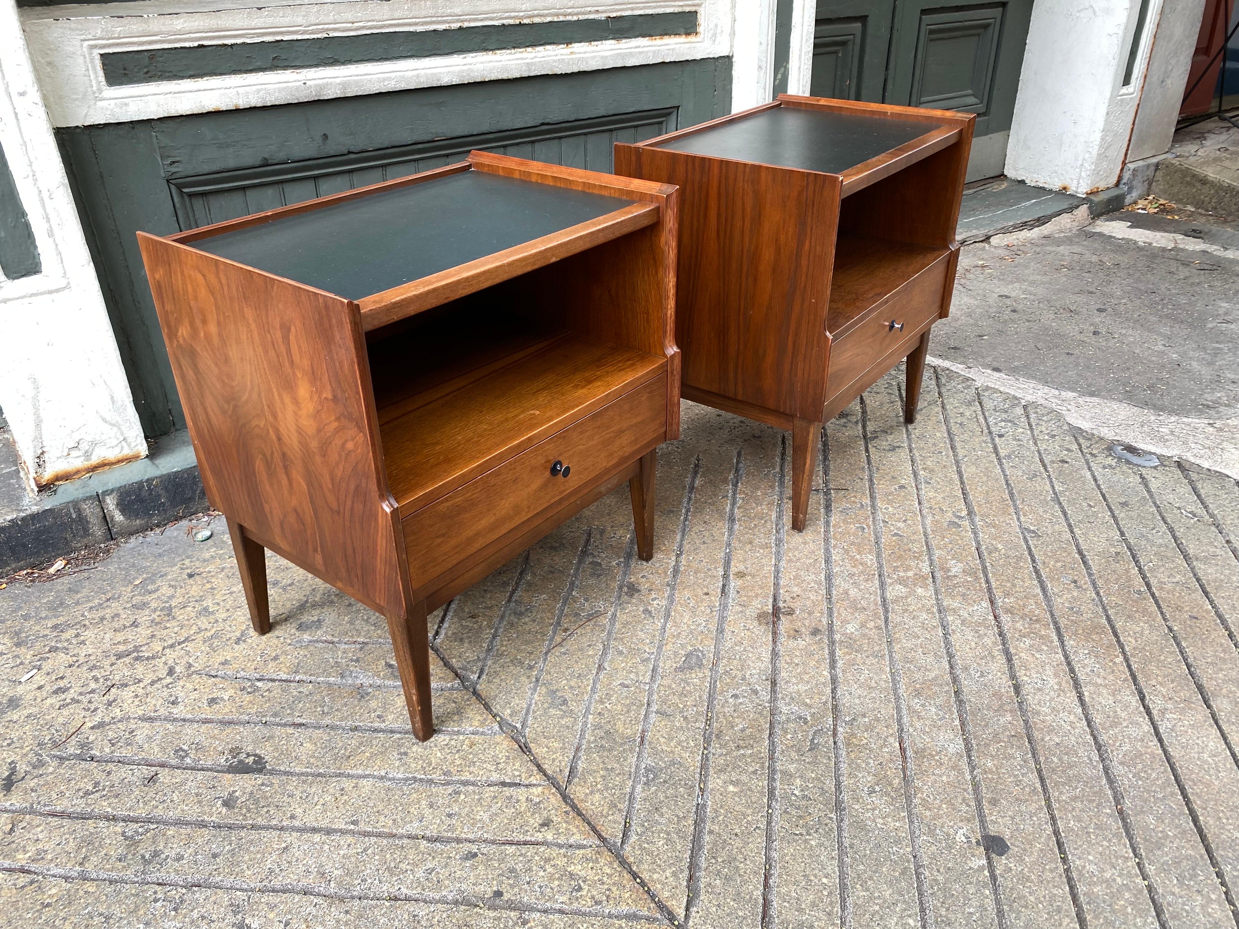 American of Martinsville Walnut Nightstands with black formica inlaid tops.  One drawer and open space below top for storage.  Nice bevel detail to edges.  In original condition!  Shows minor signs of wear as seen in photo.