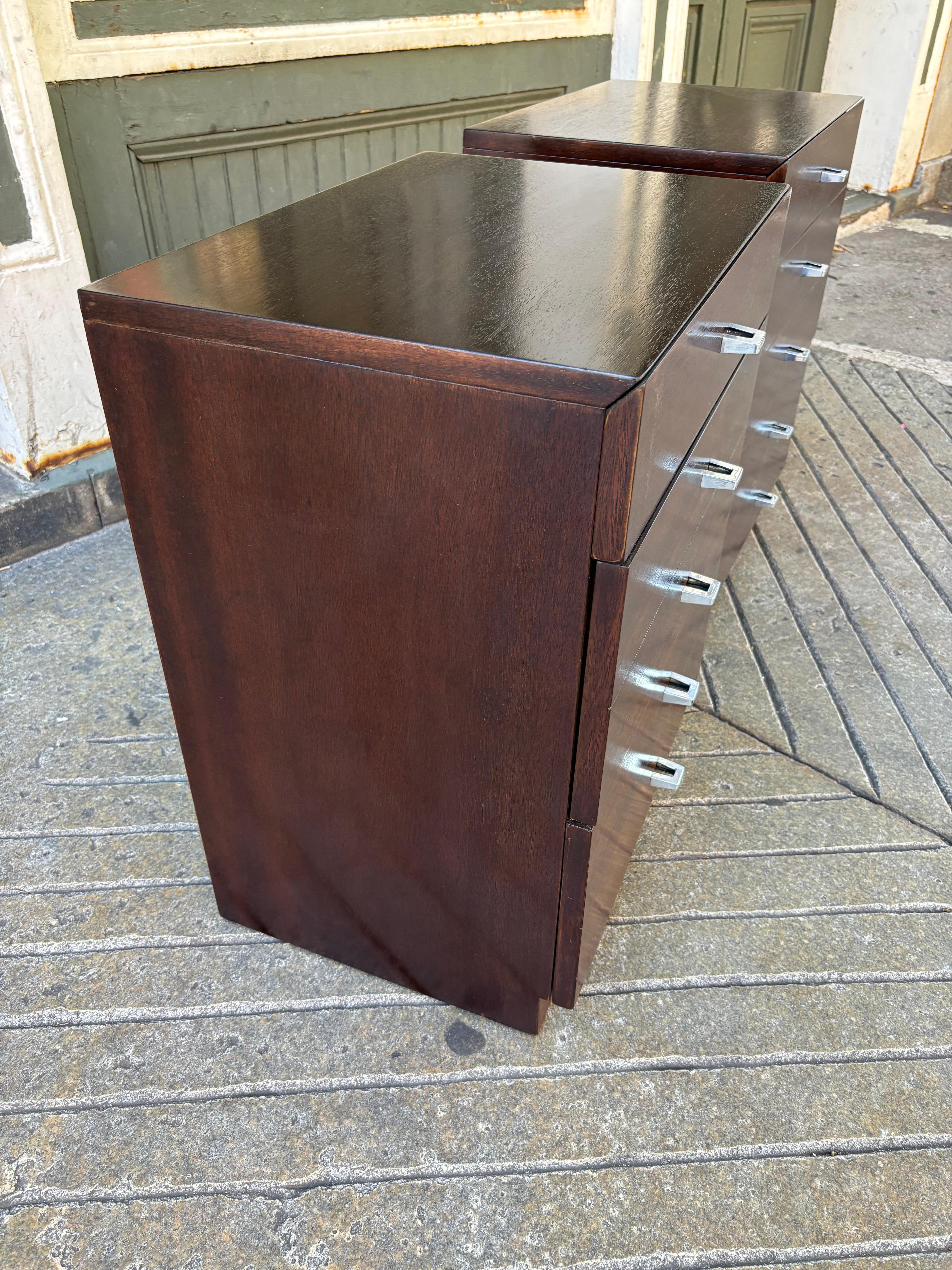American of Martinsville pair of Walnut Nightstands.  Newly refinished and ready to go!  Each cabinet has 3 drawers with metal pulls.  Nice scale and size!  One top shows a scratch that sometimes shows when light is hitting it!  See photos!