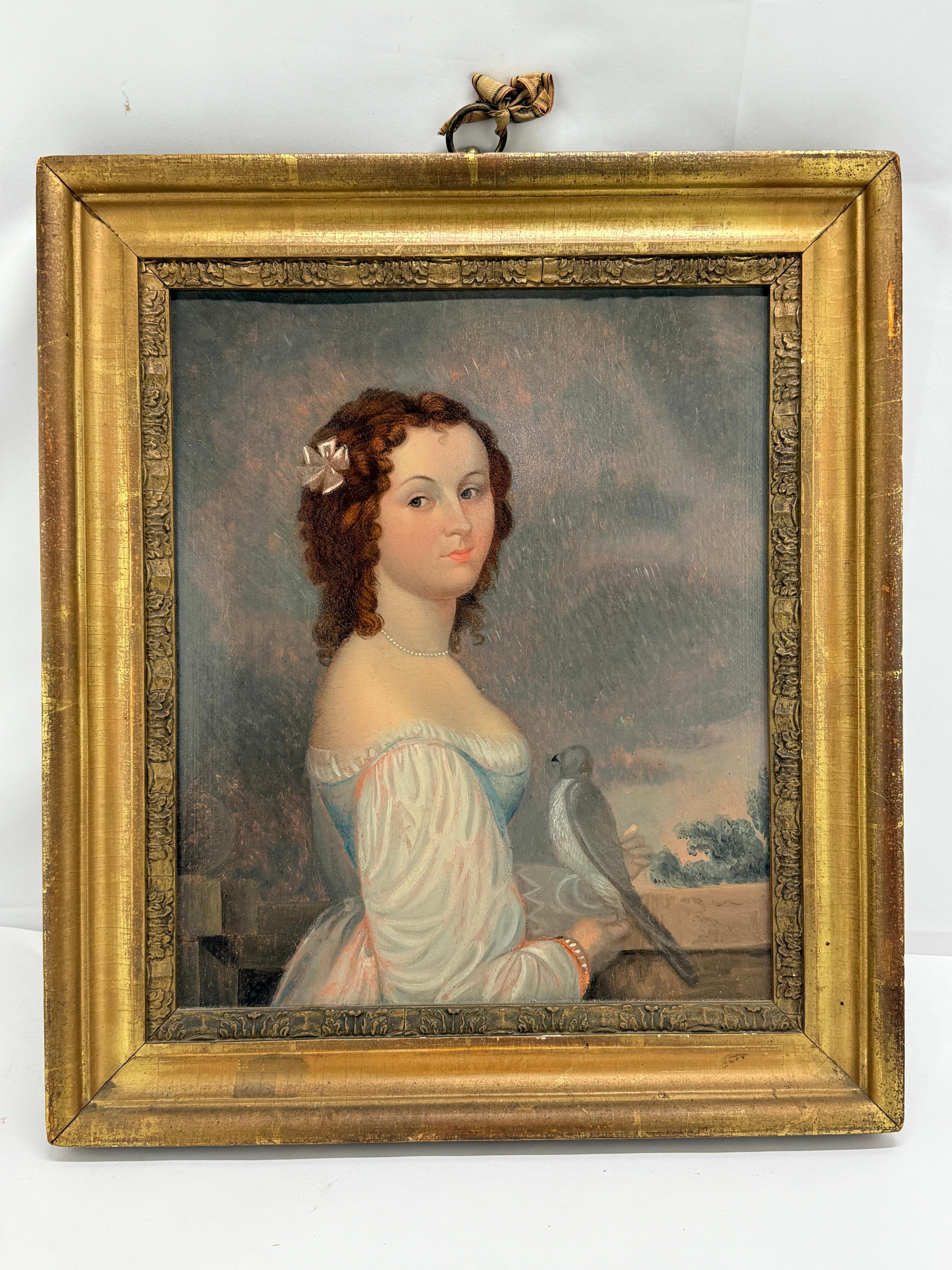 This early 19th-century oil painting presents a delicately rendered half-length portrait of a young woman, executed in a refined provincial manner aligned with American or French folk art traditions. The sitter, posed against a subtly modulated
