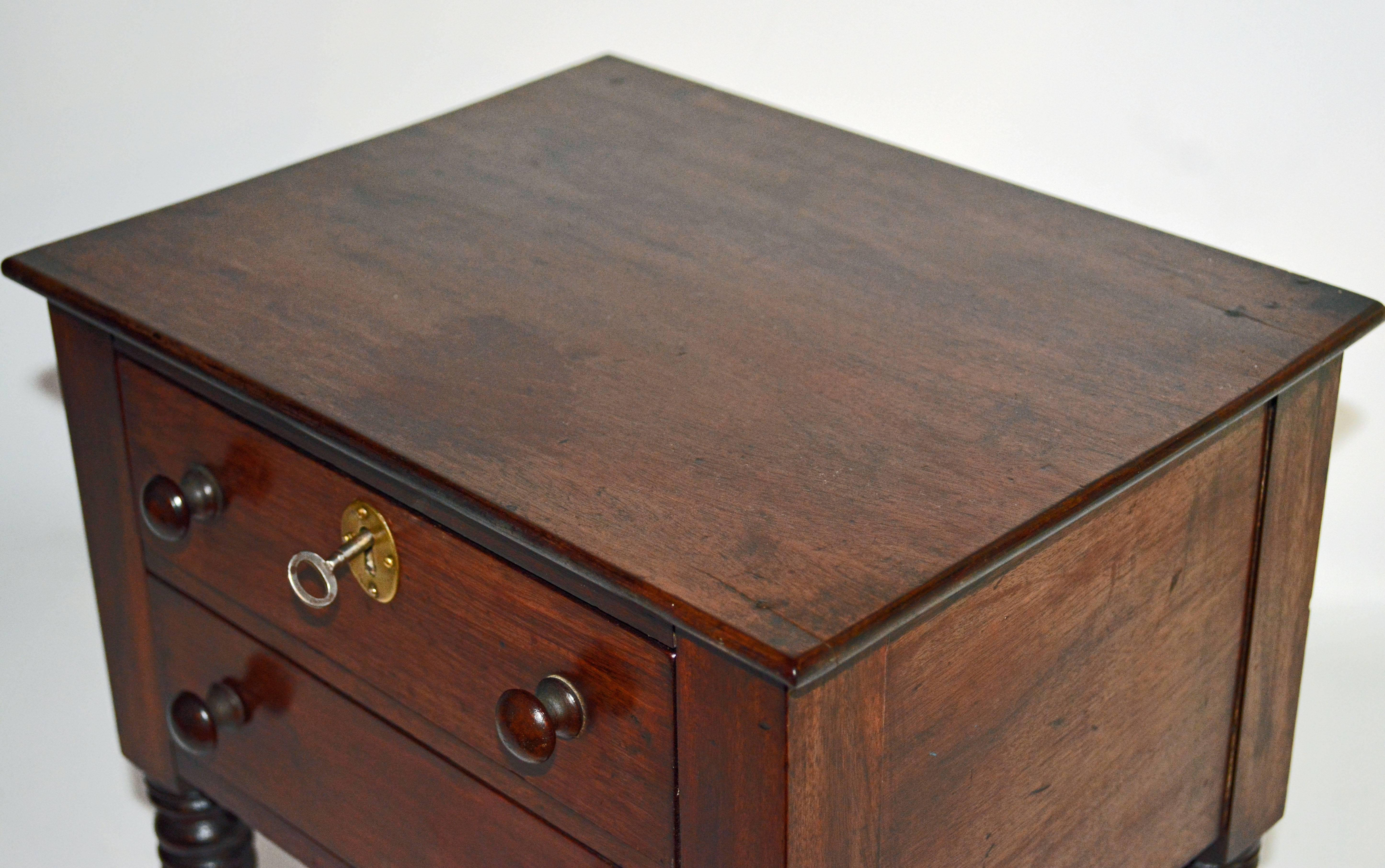 American, Pa. 19th Century Mahogany Miniature Two-Drawer Chest on Turned Legs 4