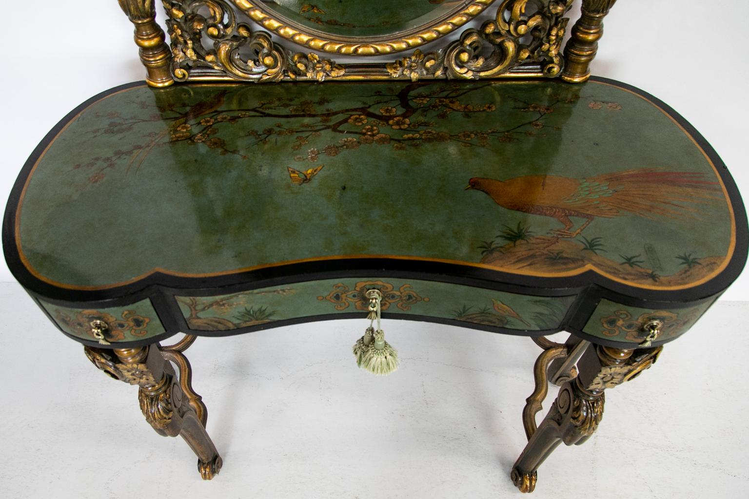 The top of this vanity has painted decoration in oriental designs of birds, butterflies, and floral branches. The mirror is beveled and framed in lavish carvings done in high relief.

Additional measurements:
Knee hole H 25 x W 28.