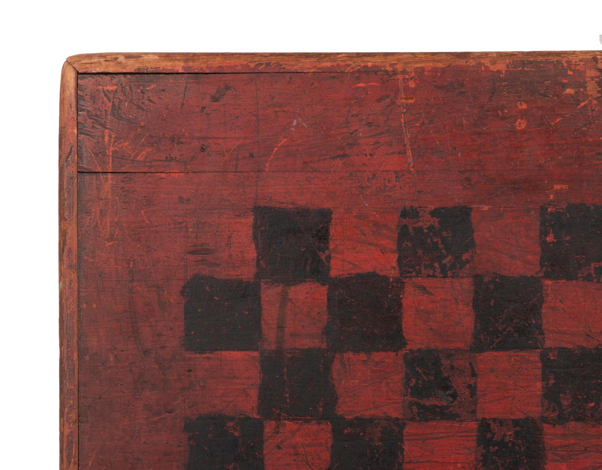 American Parcheesi Board in Salmon & Black Paint, with dutch style pinwheel decoration, exceptional surface, great graphics, and impressive scale, circa 1830-1850

19th century American Parcheesi game board in salmon red paint, with a black grid