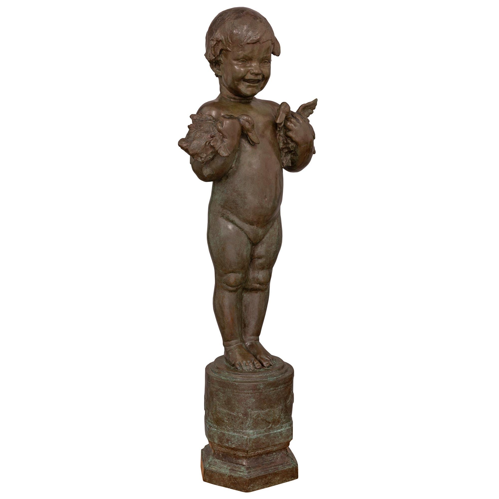 A sensational and most charming American turn of the century patinated bronze statue of 'Duck Baby', signed Edith Barretto Parsons E.G.F., I.C. The bronze is raised by a hexagonal mottled base with a wrap around design with ducks. Above, the