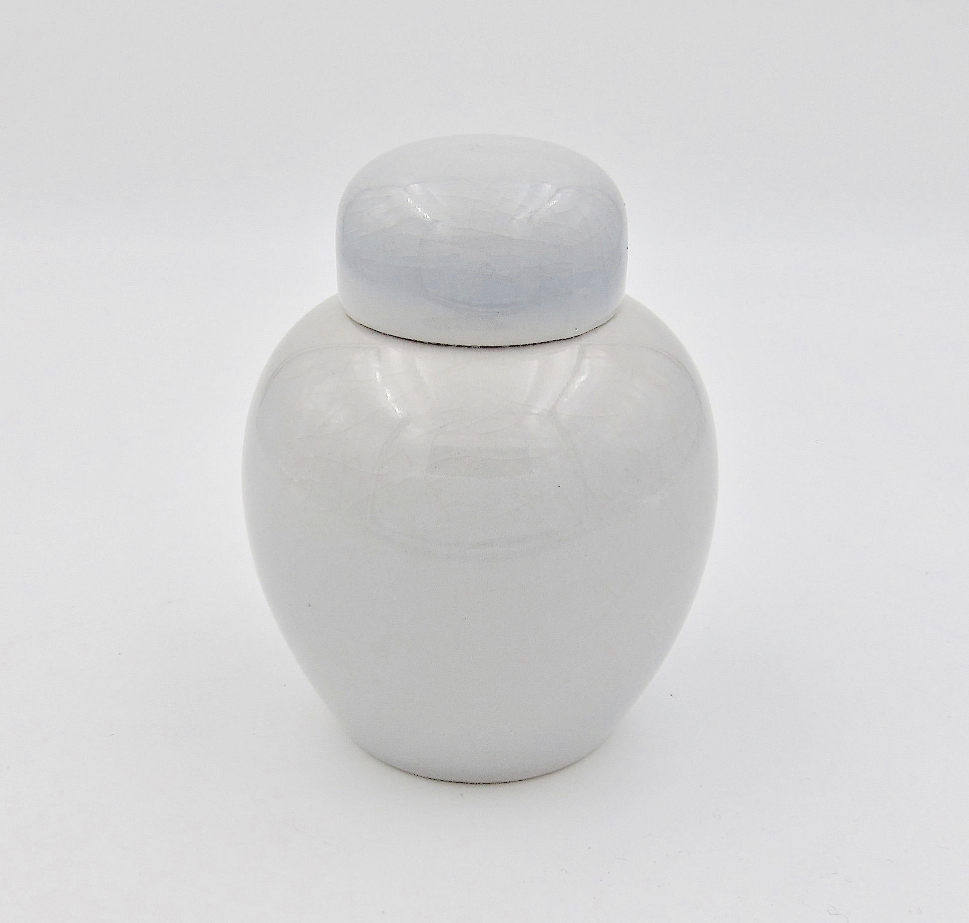 white vase with lid