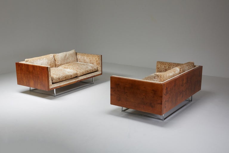 Milo Baughman; Love seats; Burlwood; Chrome base; American; Post-War design; 

American Post-War pair of Milo Baughman Love seats with a floating effect. The sofas are made out of a remarkable wooden burl frame with a chrome base. The sofas still