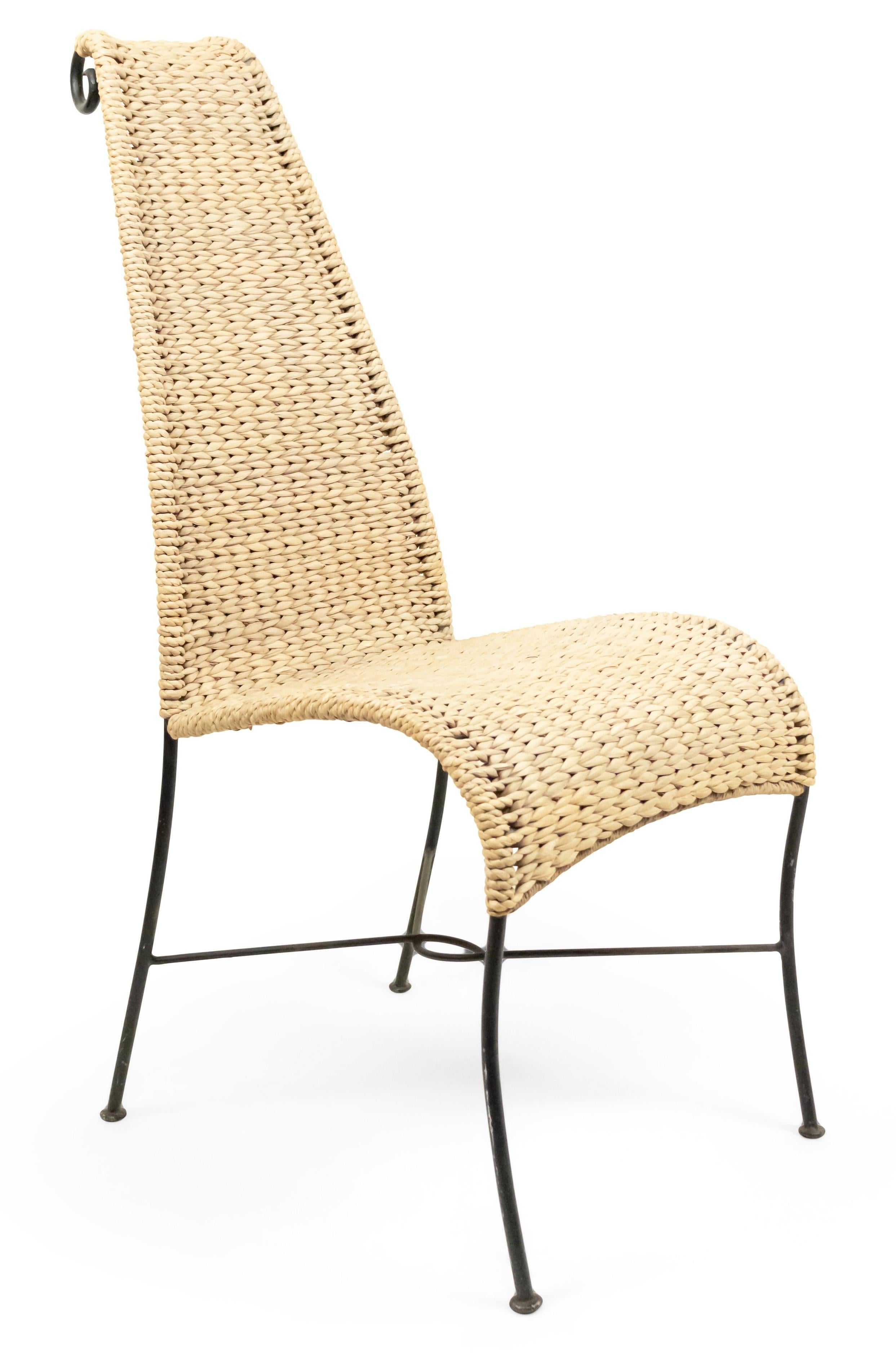 American Post-War Design natural rattan woven side chair with tapered designed high back and a black iron frame.
 