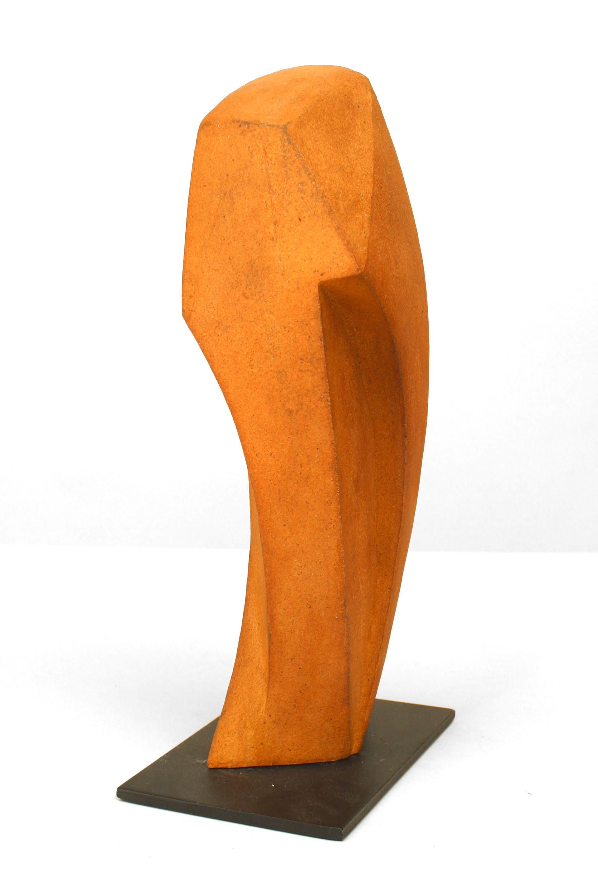 American Post-War Design rust colored ceramic porcelain sculpture of a vertical form with geometric shape on an iron base. (Kevin Kelly).
 