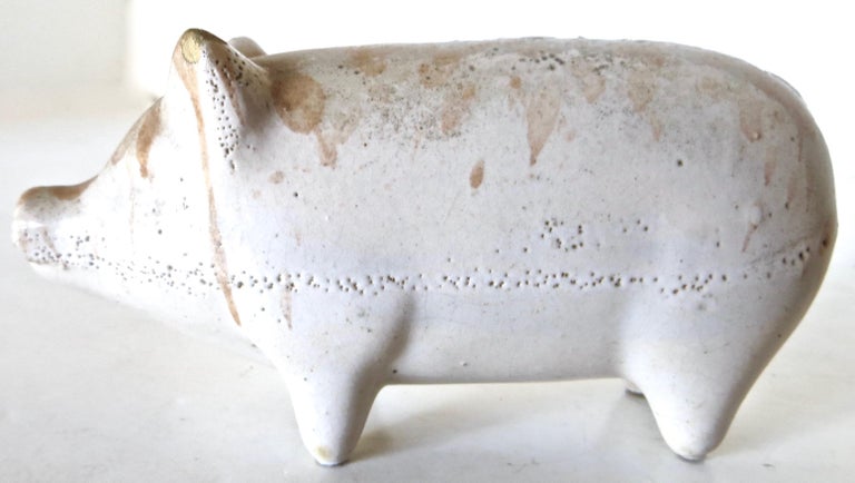 American pottery still bank in the shape of a pig, used for saving coins (usually pennies) to encourage children the importance of thrift. Pottery still banks are somewhat scarce since the typical way to remove coins was to smash the bank open,