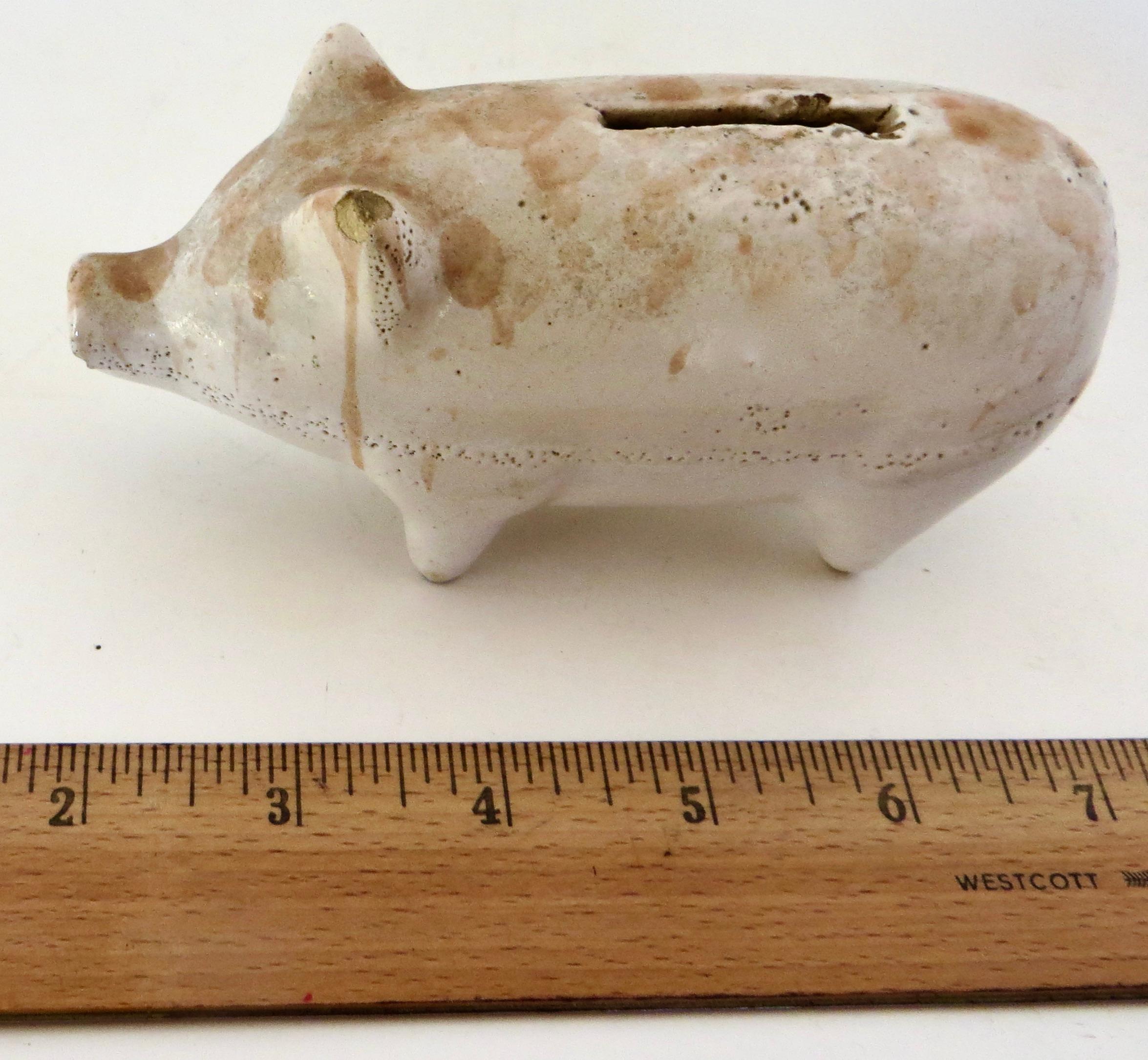 American pottery still bank in the shape of a pig, used for saving coins (usually pennies) to encourage children the importance of thrift. Pottery still banks are somewhat scarce since the typical way to remove coins was to smash the bank open,
