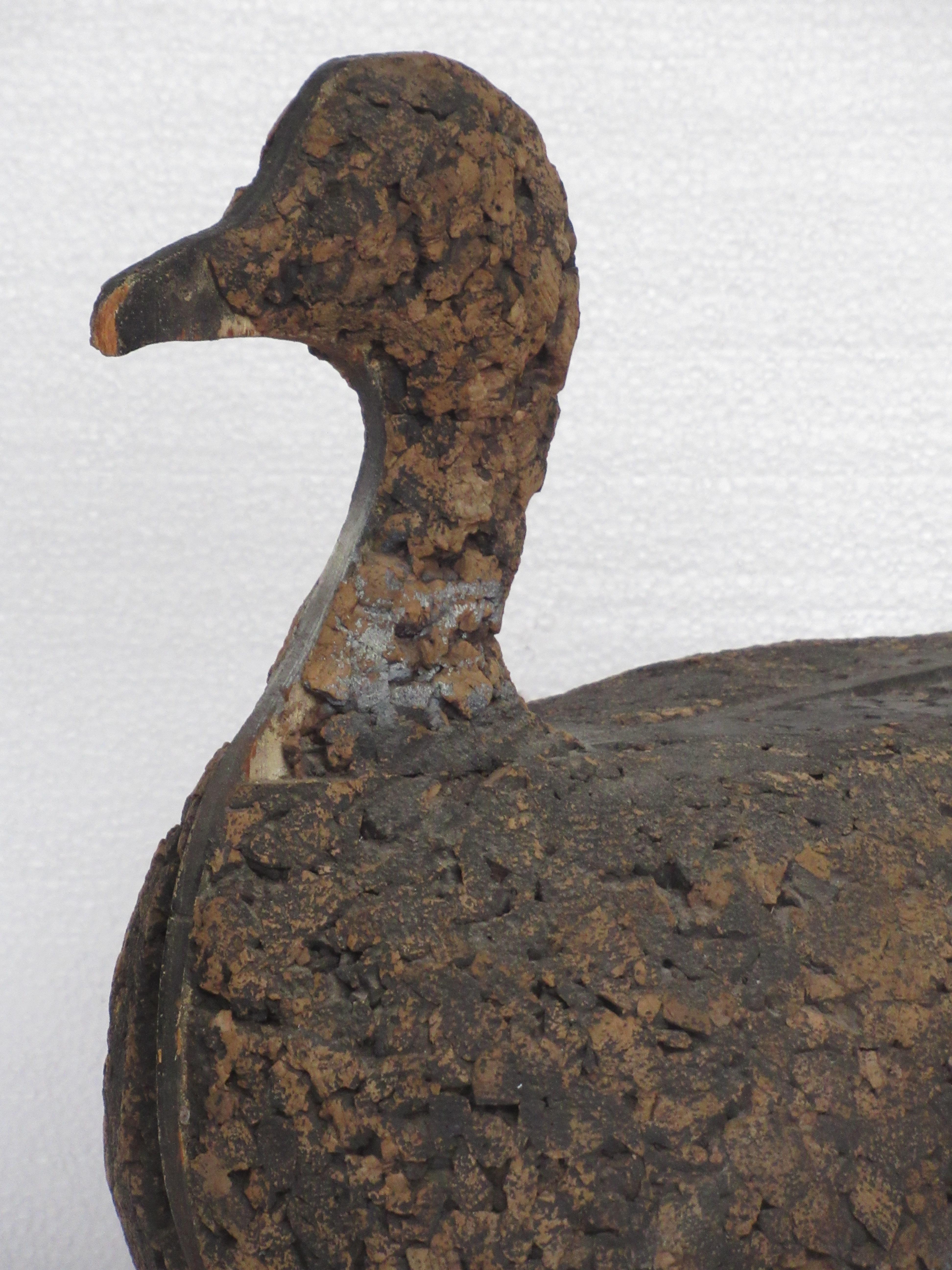 Antique American Folk Art large-scale working cork Canadian goose duck decoy that is fully divided by wood in center that ends in both a wood beak and a wood bottom rudder. It is incise signed at painted wood rudder but cannot clearly make out the
