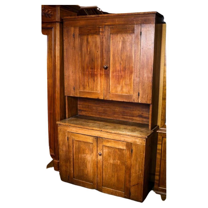 Antique American Primitive Cherry One Piece Hutch W/ 2 Upper Cabinet Doors Surmounting 2 Lower Cabinet Doors w/ Intermediate Open Work Shelf. Original cherry wood pulls. Retains early finish with great patina. Handcrafted solid joinery.