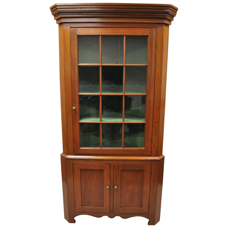 American Primitive Colonial Cherrywood Wavy Glass Corner Cupboard China Cabinet For Sale