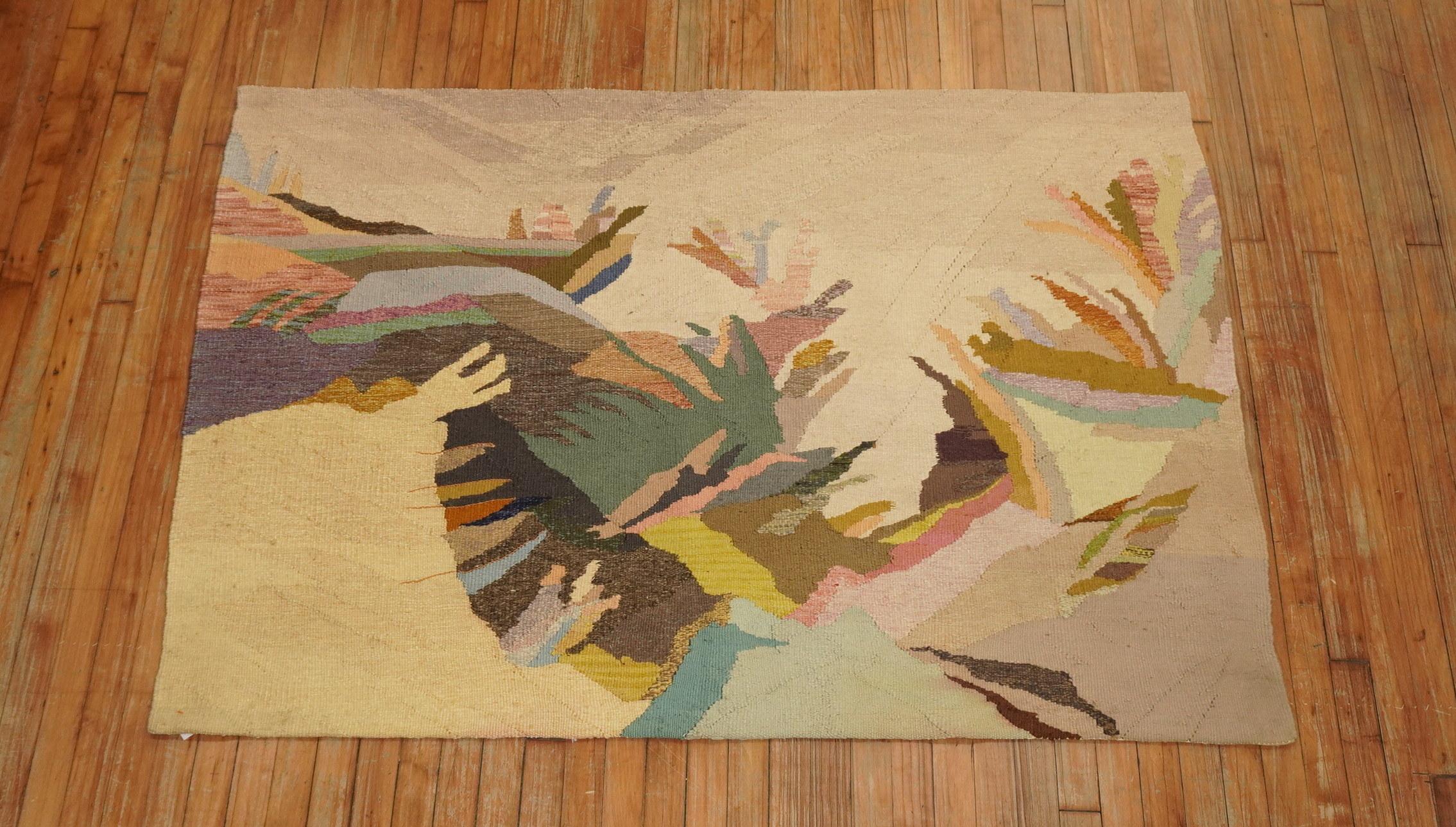 A late 20th century one of a kind North American Kilim with a landscape scenery motif in warm colors. 

Measures: 3'10” x 5'6” dated 1986 name of weavers are sewn on the back of the rug.