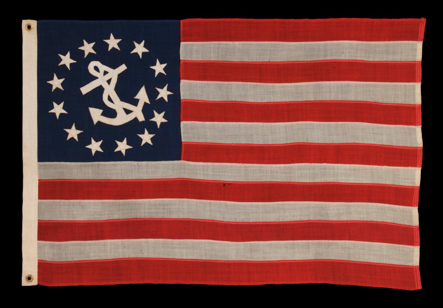 ANTIQUE AMERICAN PRIVATE YACHT FLAG (ENSIGN) WITH 13 STARS, 1895-1926 ERA :

The medallion configuration, 13-star, 13-stripe flag with a canted center anchor was entered into official use in 1848, following an act of Congress, that made it the