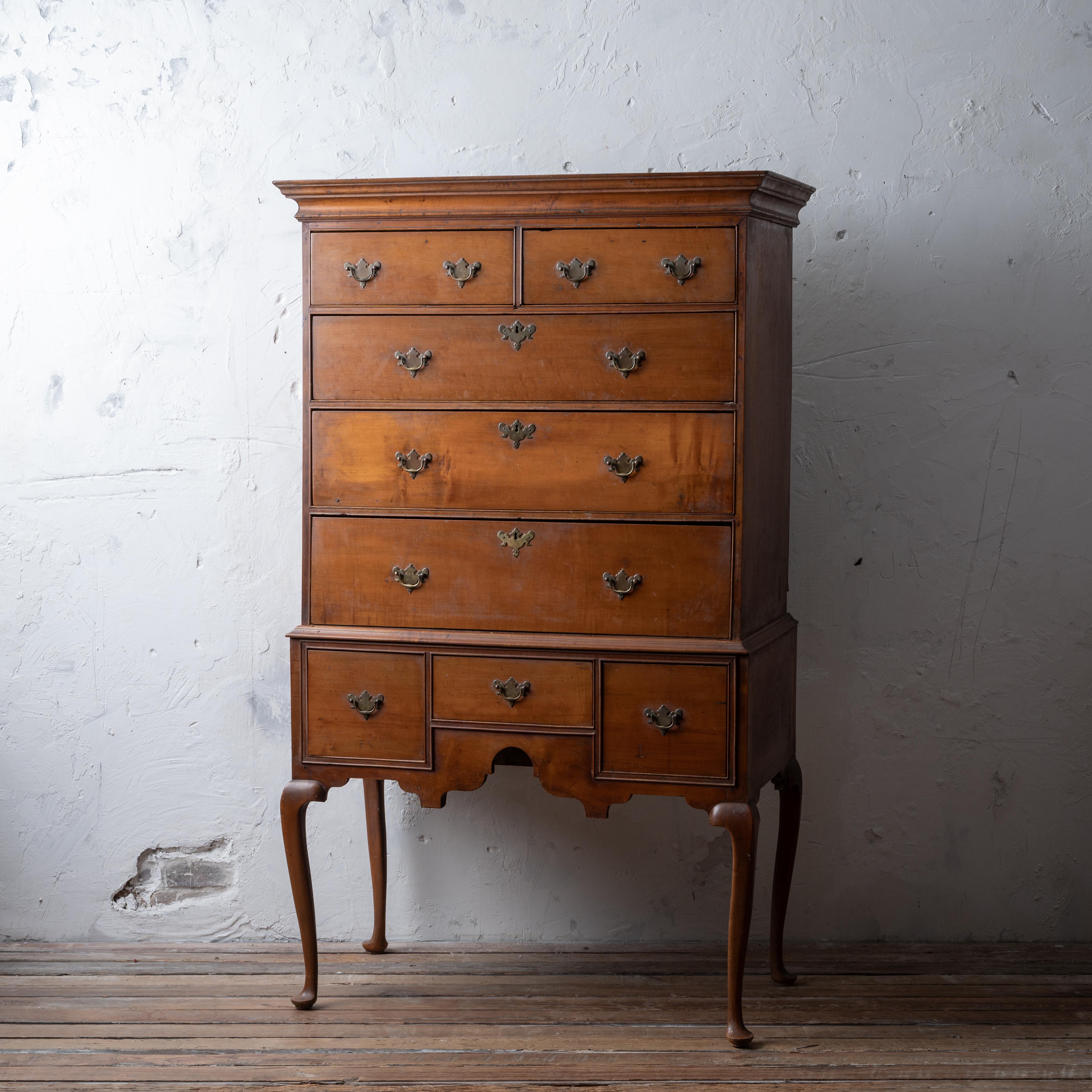 An American Queen Anne maple highboy, circa 1750.
Two pieces.

Provenance: Sweringen Brother's Roundwood Manor estate auction October 28, 1938, item 1076.
Auction catalog included. 

38 ¾ inches wide by 18 ¾ inches deep (20 ½ inches deep at cornice)