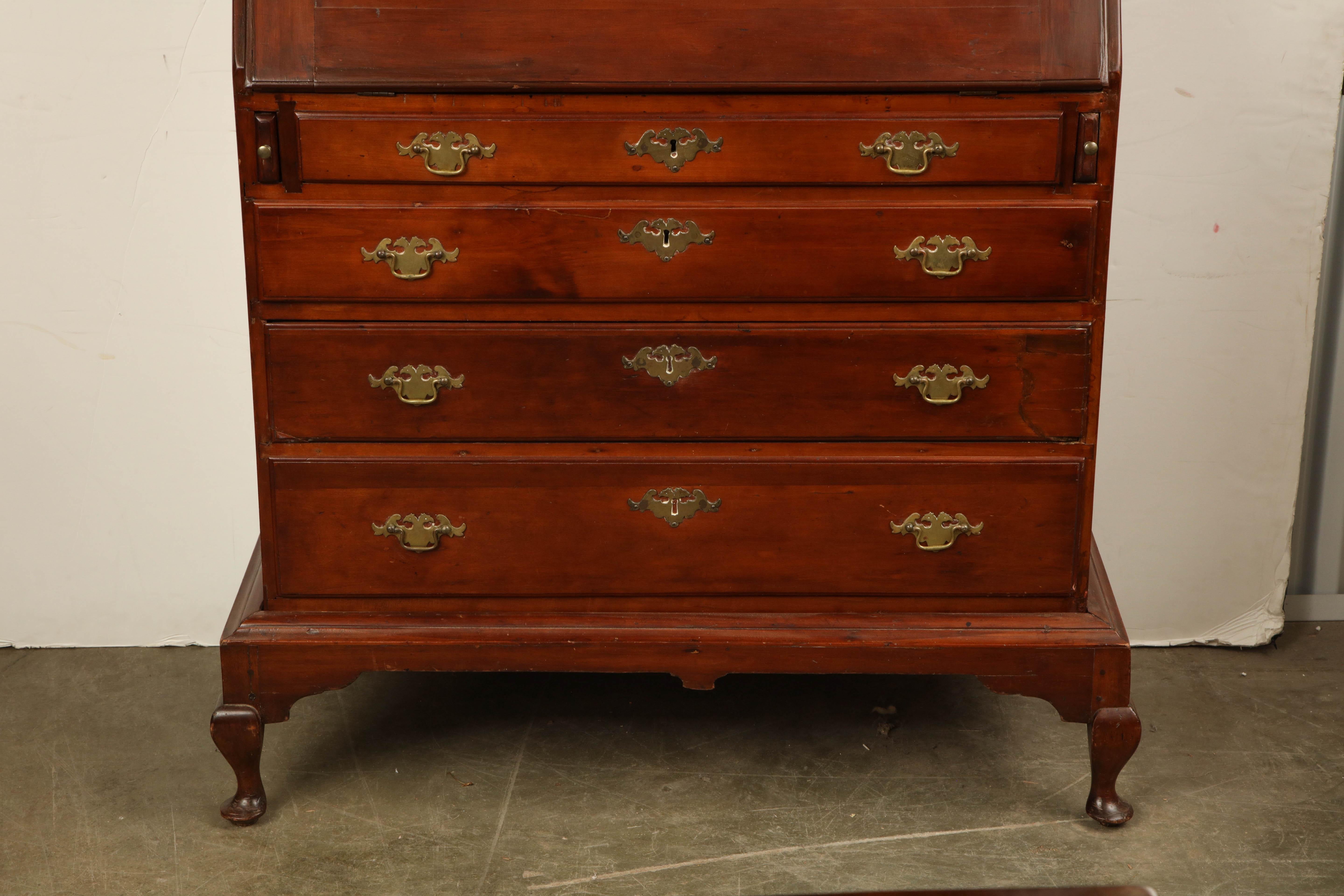 A rare American Queen Anne maple slant front desk on separate frame with blocked interior.