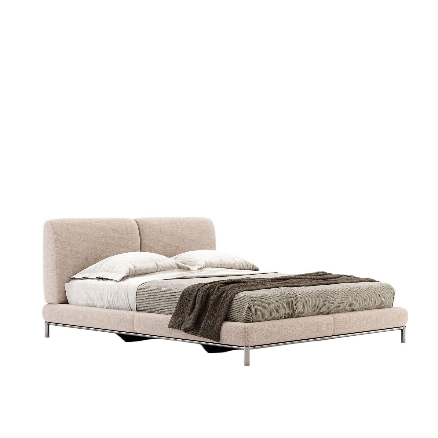 Crafted with a sophisticated silhouette and clean lines, this double bed becomes the focal point of your contemporary bedroom. This luxurious upholstered bed is generously proportioned for ultimate comfort, inviting you to sink into relaxation. This