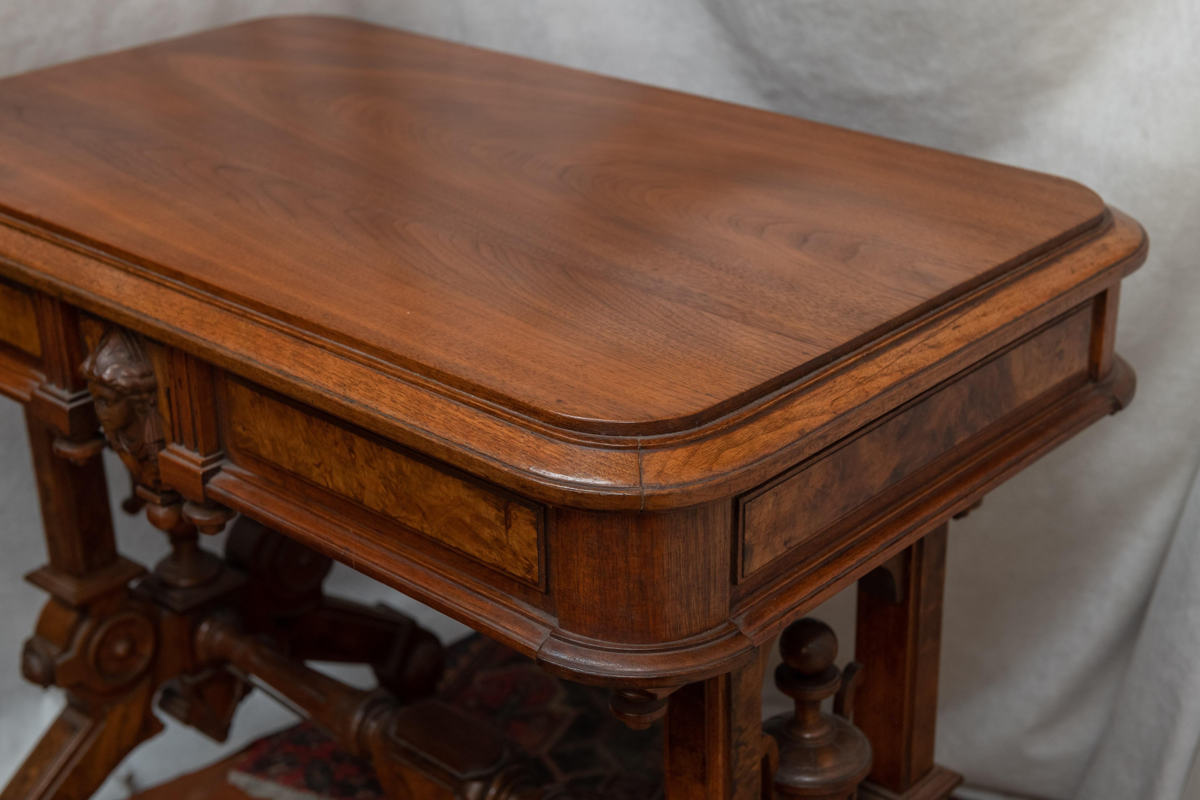 Of the 3 main periods of Victorian furniture, Renaissance Revival is generally held as the most sought after. This beautiful library table has been French polished by our master restorer. It glows with a hand rubbed finish. To describe each detail