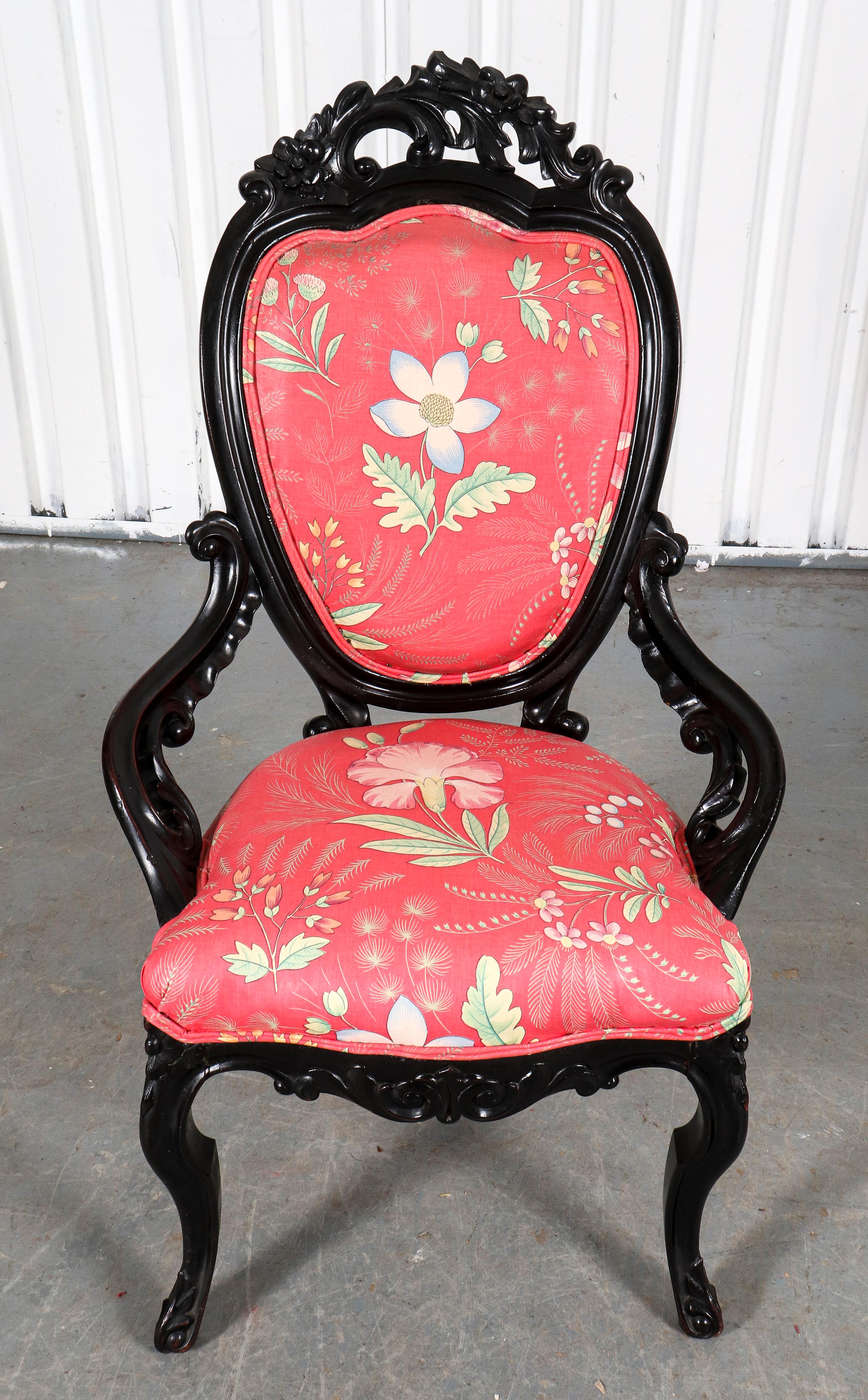 American Rococo Revival ebonized carved wood slipper chair with upholstered seat and back.