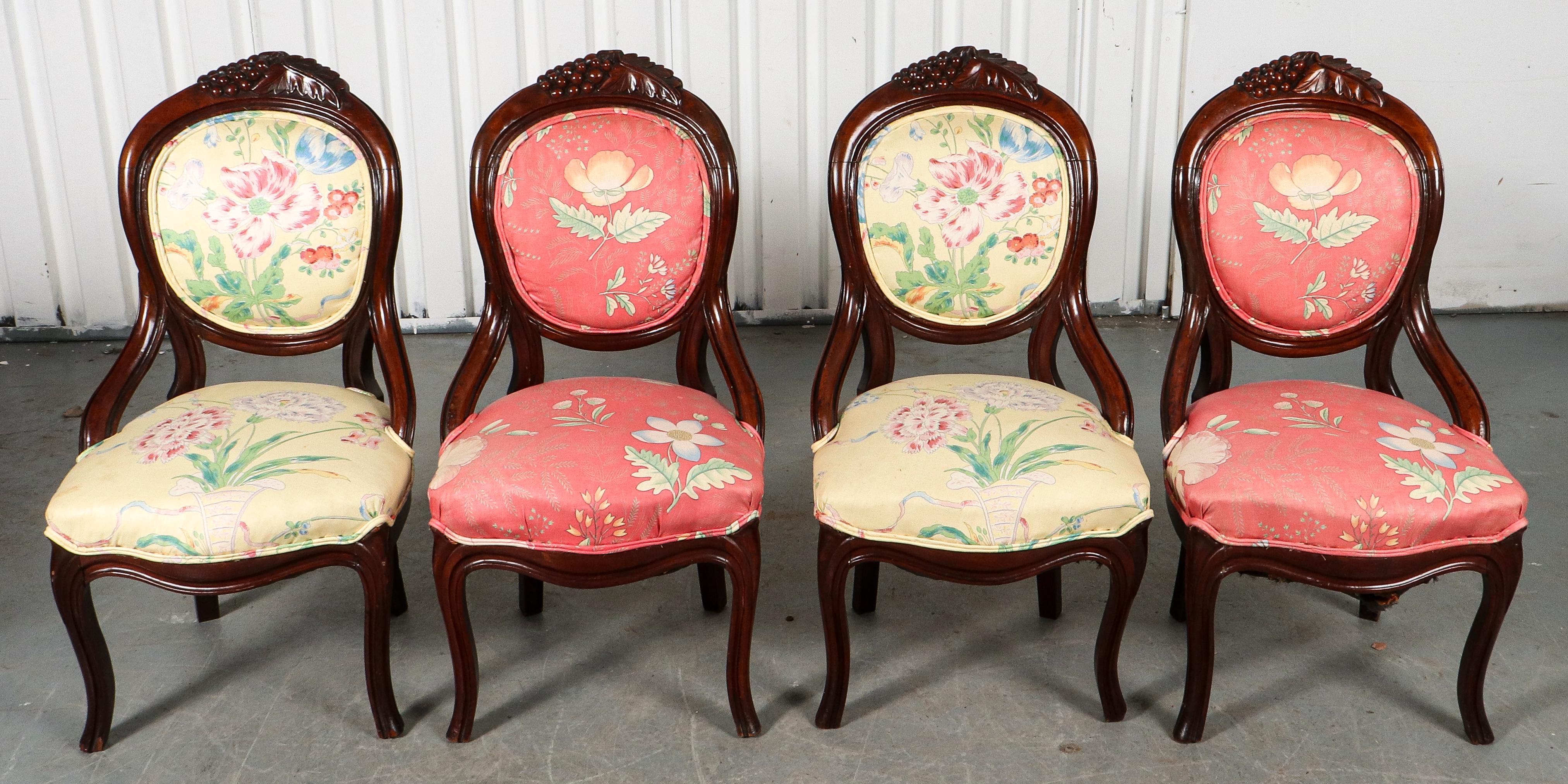 American Rococo Revival style set of four carved wood side chairs or dining chairs Belter style with carved grapes and vine leaves on top of upholstered back. 

Dealer: S138XX