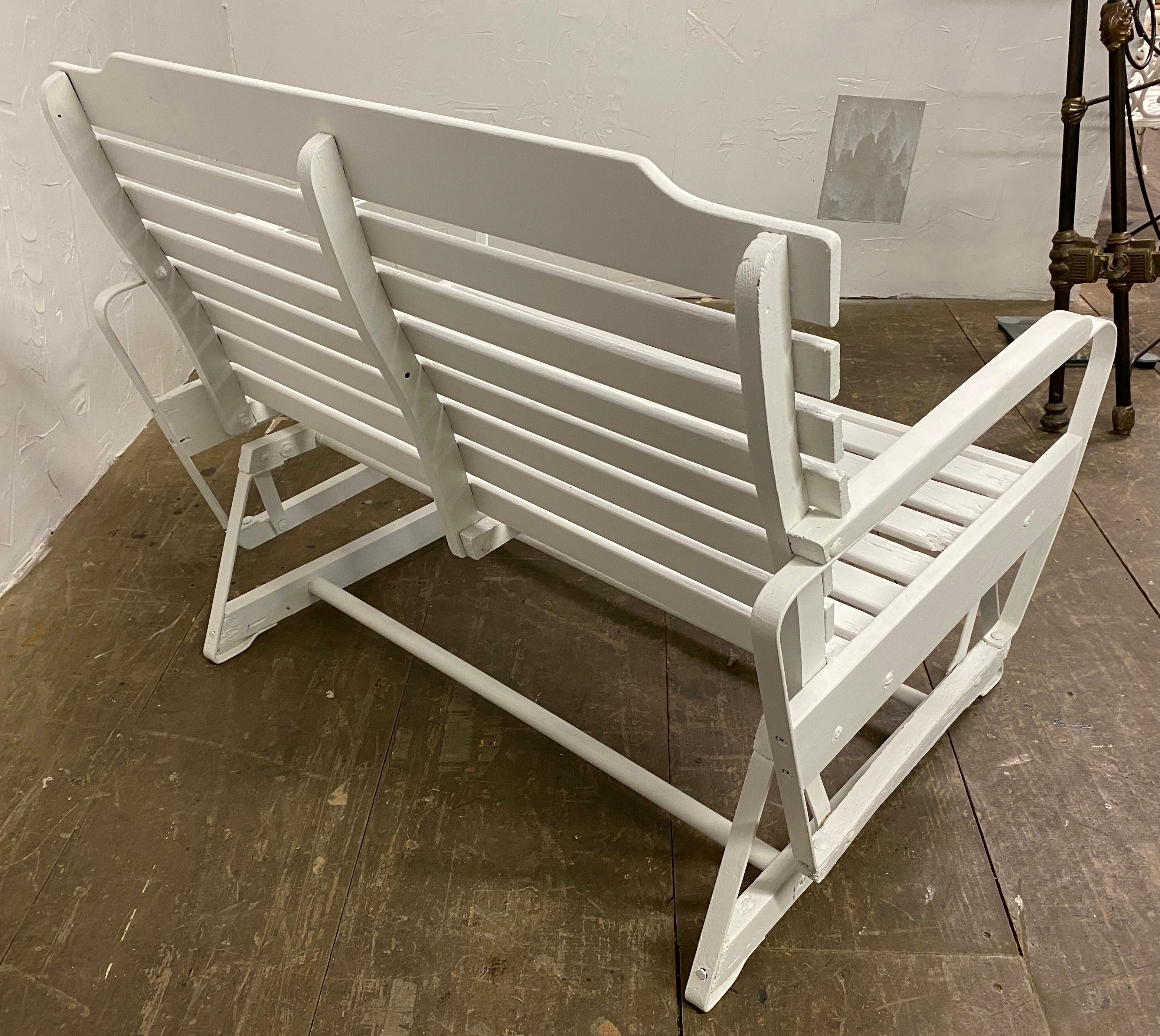 A wonderful outdoor patio glider freshly painted white. Lean back and relax on your porch, patio or garden and enjoy the smooth gliding rocking motion of this loveseat.
 