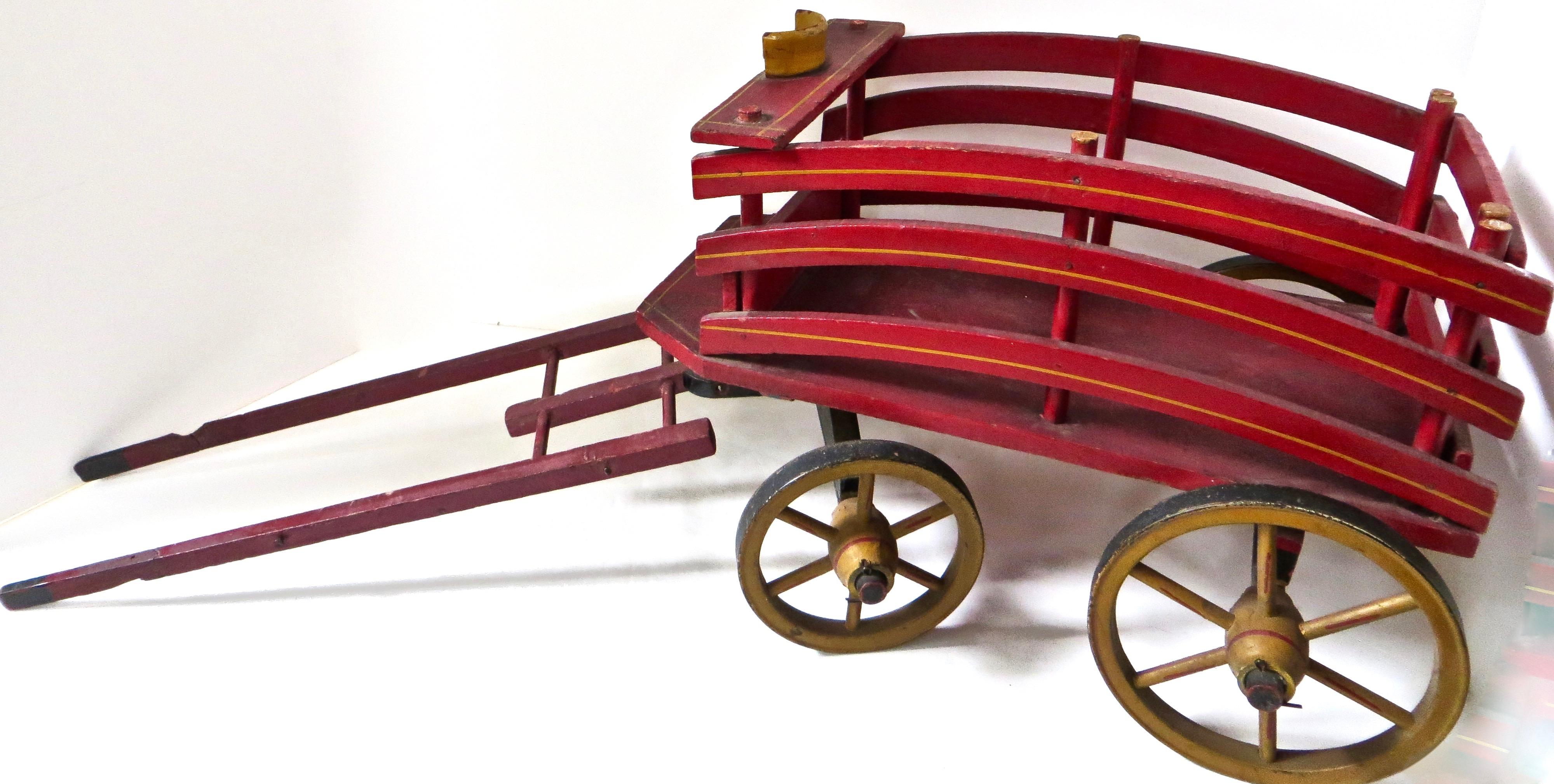 SALESMAN SAMPLE: Late 19th C. American (4) wheeled hand carved all wooden horse drawn hay wagon, in excellent condition with original gold stenciling to carriage, red stenciling to wheels; in authentic red paint. Metal wheel rims. Slight repair to