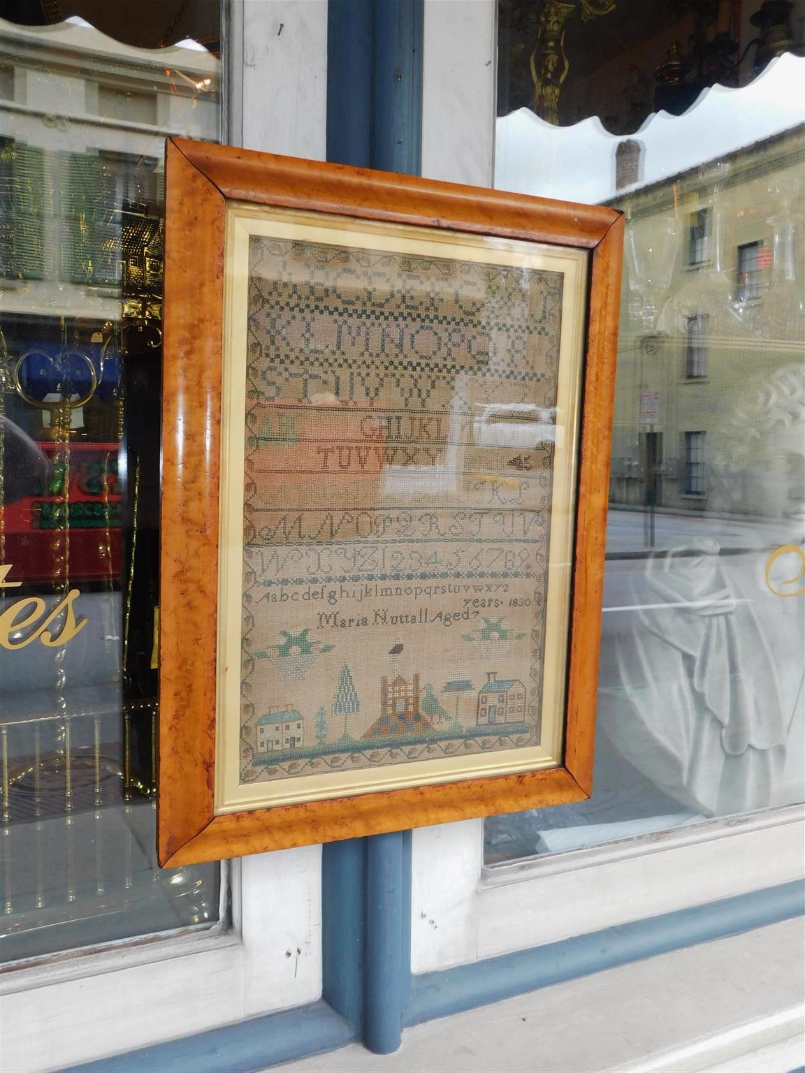 American sampler under glass with the original gilt Birdseye maple frame, Early 19th Century. Alphabet and Numerals. Signed by maker Maria Nuttall Age 7.