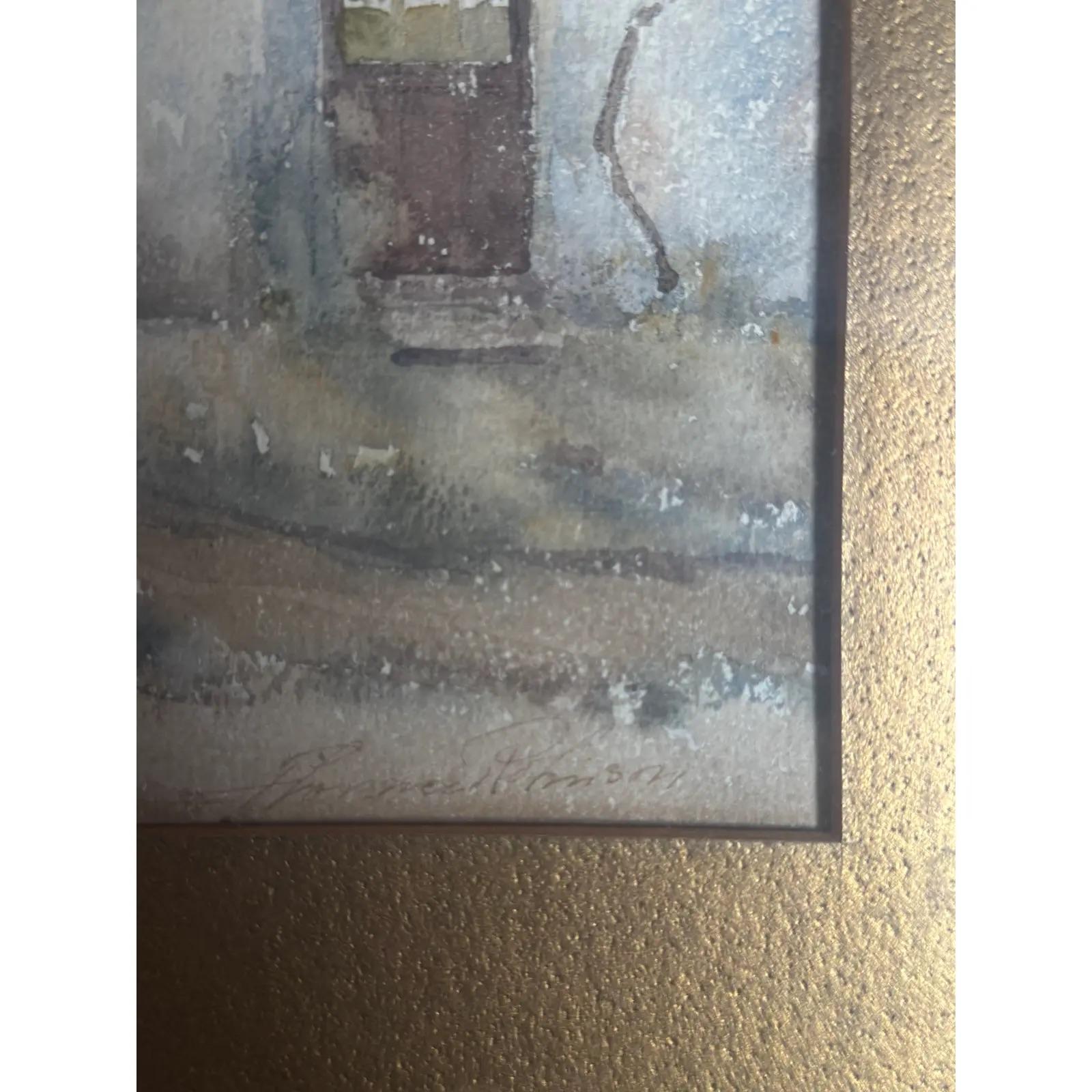 American School watercolor on paper, village scene, c. early 20th century. Decoration missing from bottom of frame. 

Signed illegibly lower right.