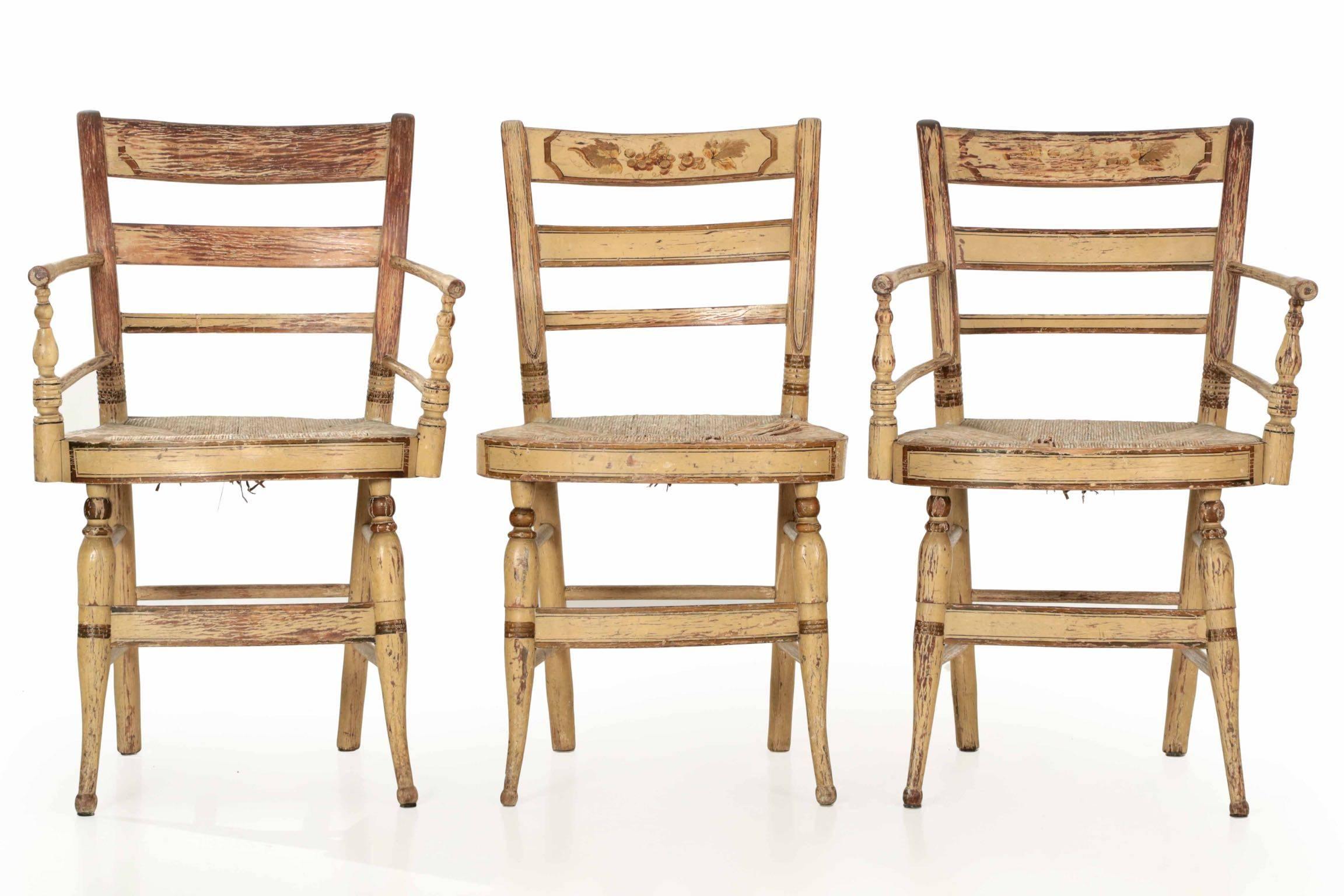 A most interesting and rather rare collection of 11 “fancy” Sheraton chairs, these have remarkably remained together for nearly two-hundred years. They retain a very early and almost certainly original painted surface, the slat back crest with