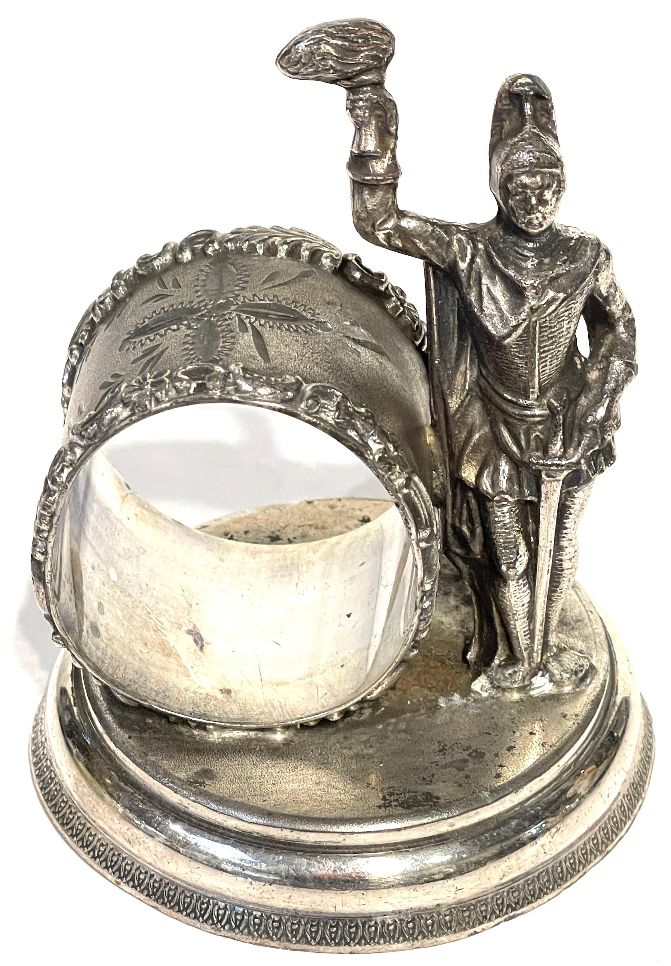 American Silverplated Figural Napkin Ring of a Knight with Sword and Torch 
Knickerbocker Silver Company, USA
This unique American silverplated figural napkin ring by Knickerbocker Silver Company showcases a knight in full regalia, a captivating