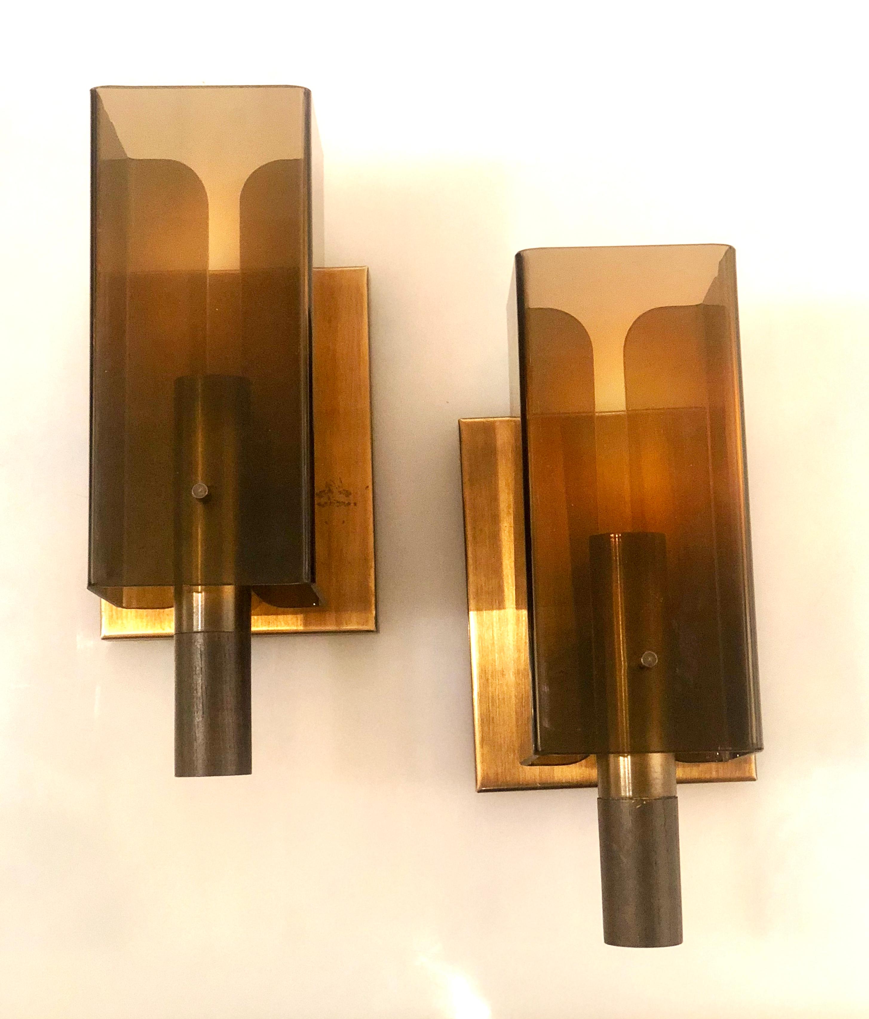 Nice pair of smoke Lucite and patinated copper wall sconces, with walnut wood accents in very nice and clean condition rewired, circa 1970s.