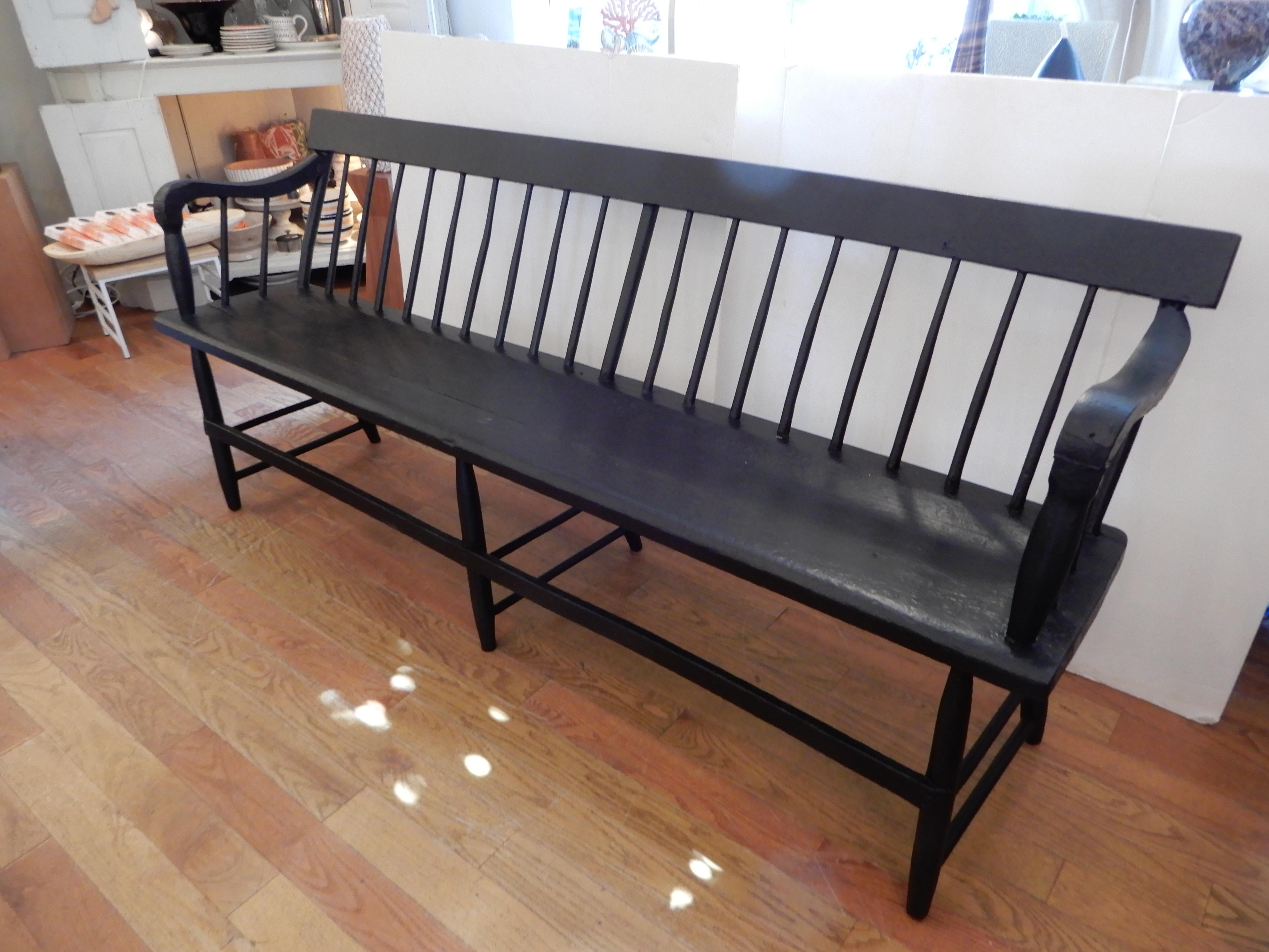 A classic American form, an 1880s spindled bench, perfect for an entrance way or porch, slim lines that fit into most environments. A transitional piece, that works with classics and modern furniture. 
Good condition for its age, sturdy, painted