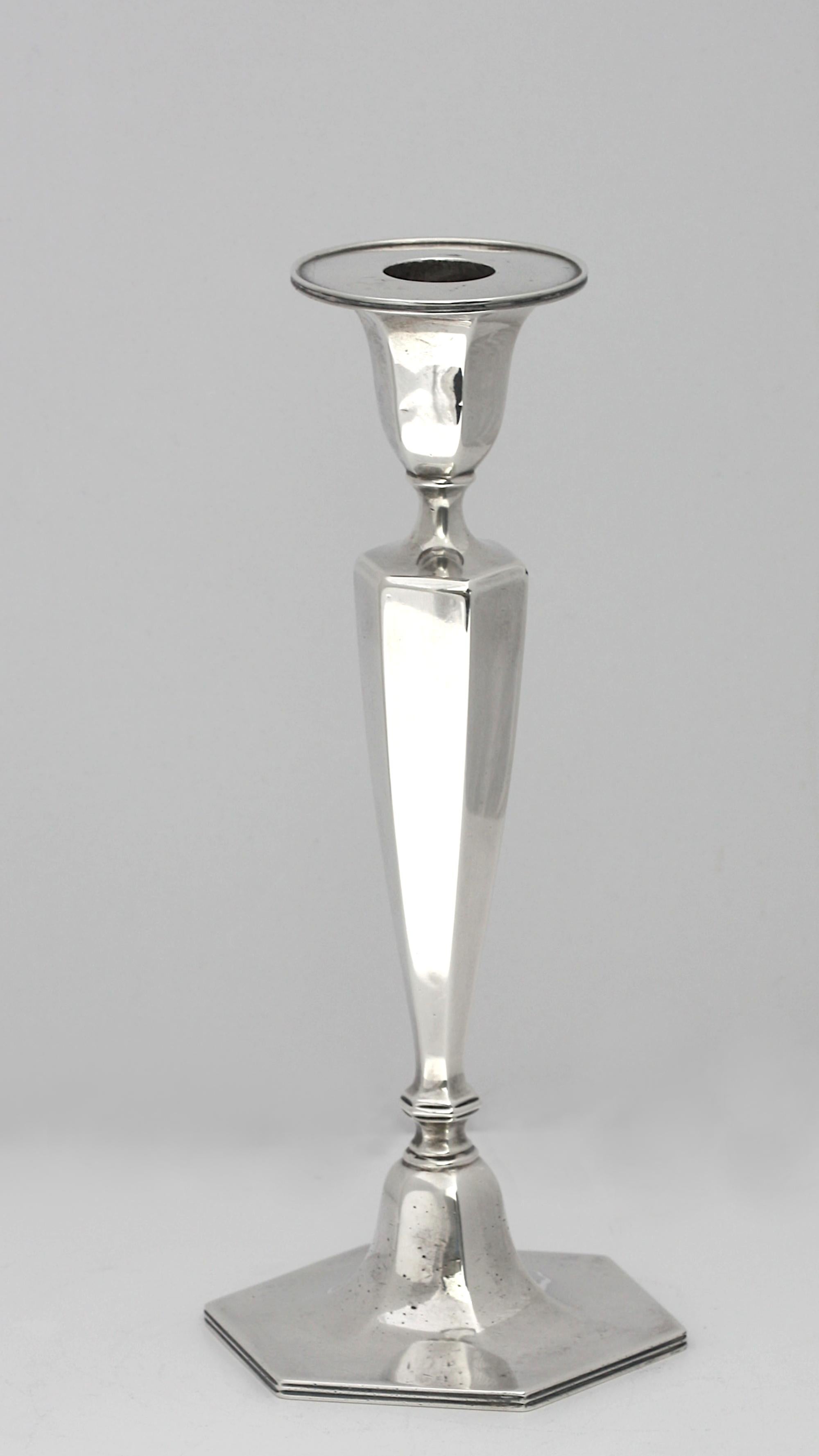 American Sterling Silver Candlestick 
1907-1938, Tiffany & Co. Of classical tapering hexagonal form, cement-filled base.
Height 9 in. (22.86 cm.) Weighing approximately 14.2 oz t.