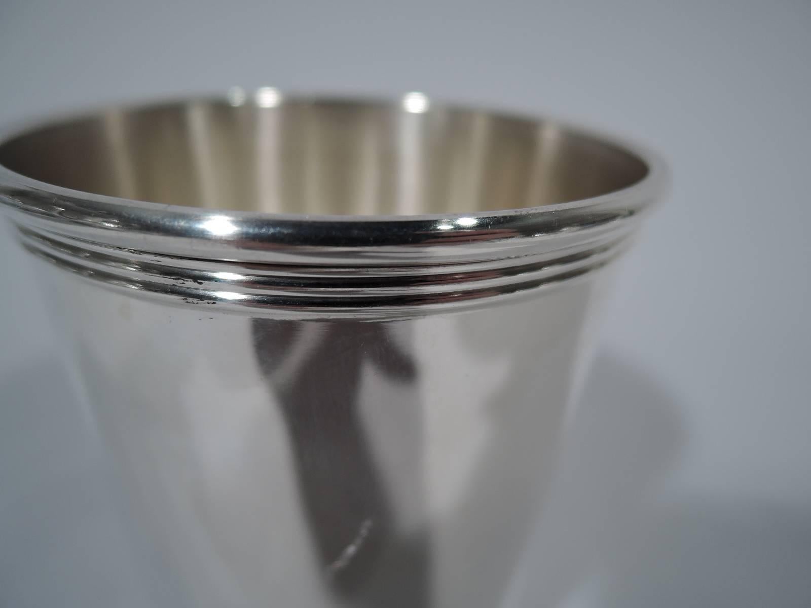 American sterling silver mint julep cup. Straight and tapering sides with reeded rim and base. Hallmarked Newport, a Gorham trademark. Hallmark includes pattern no. 1673. Weight: 3.6 troy ounces.